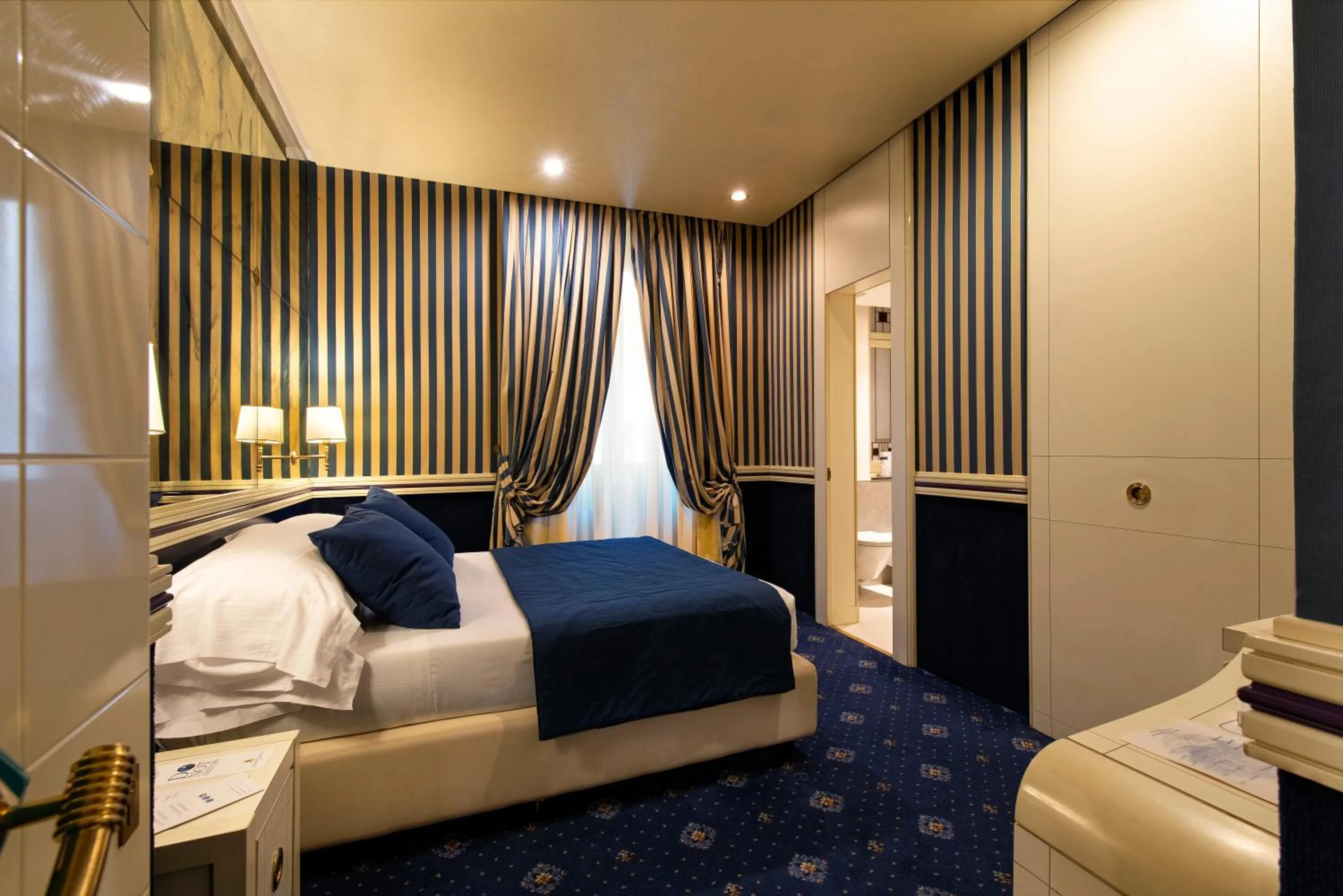 Bed in Atlante Star Hotel