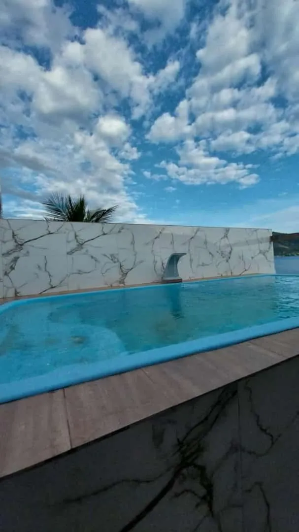 Swimming pool in Pousada toca do cambu