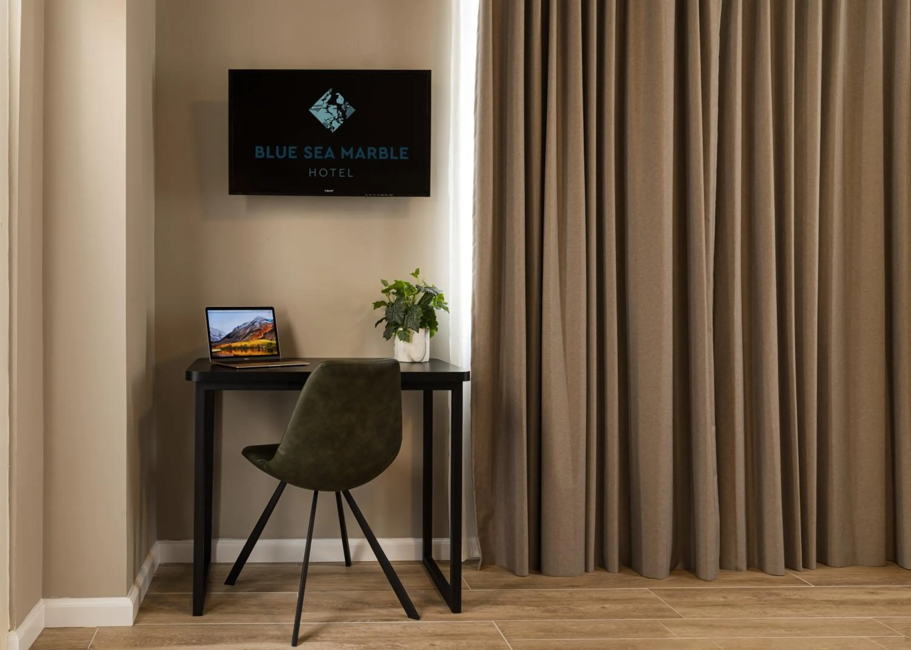 Property logo or sign in Blue Sea Marble