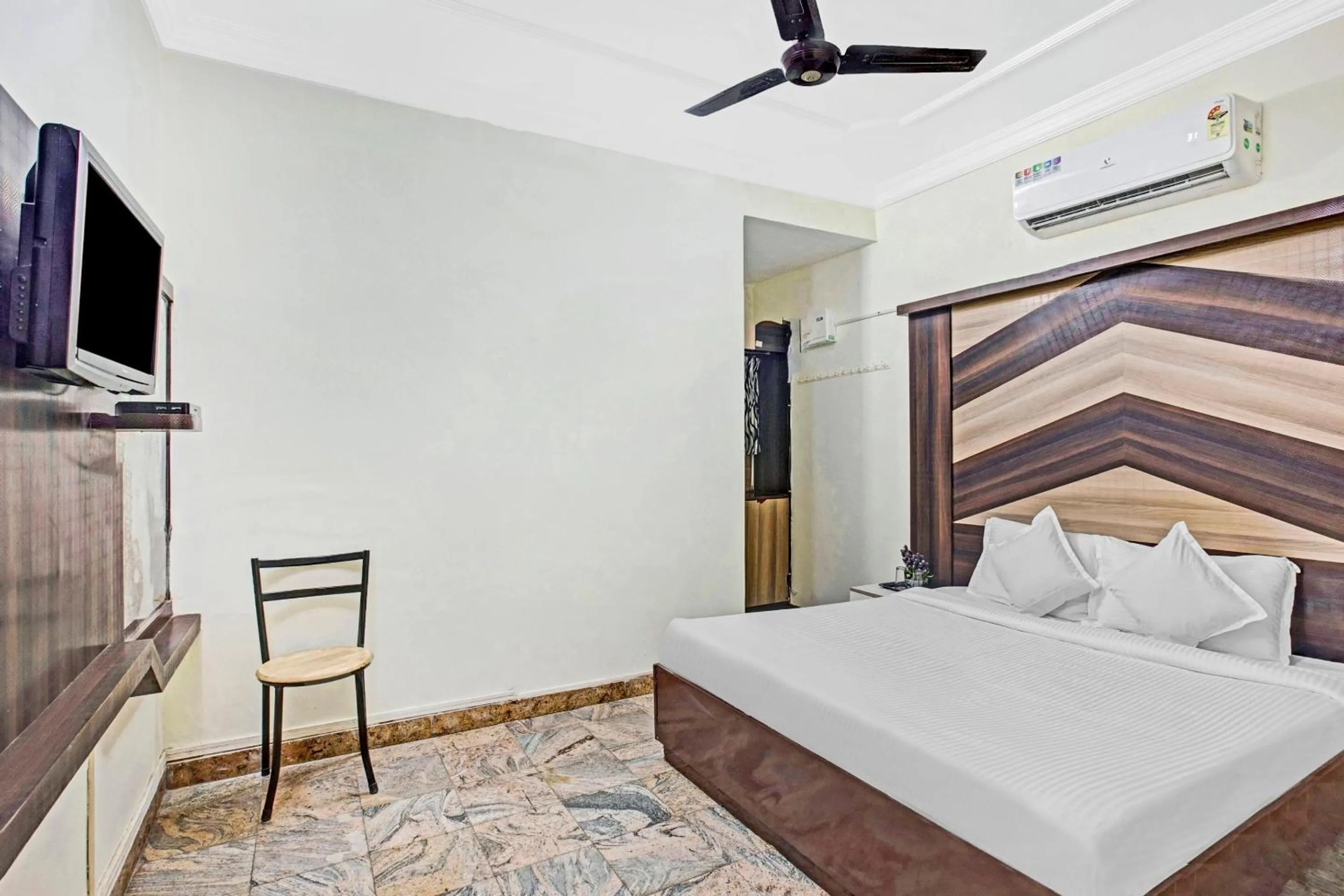Bedroom in Hotel O Neethu Residency