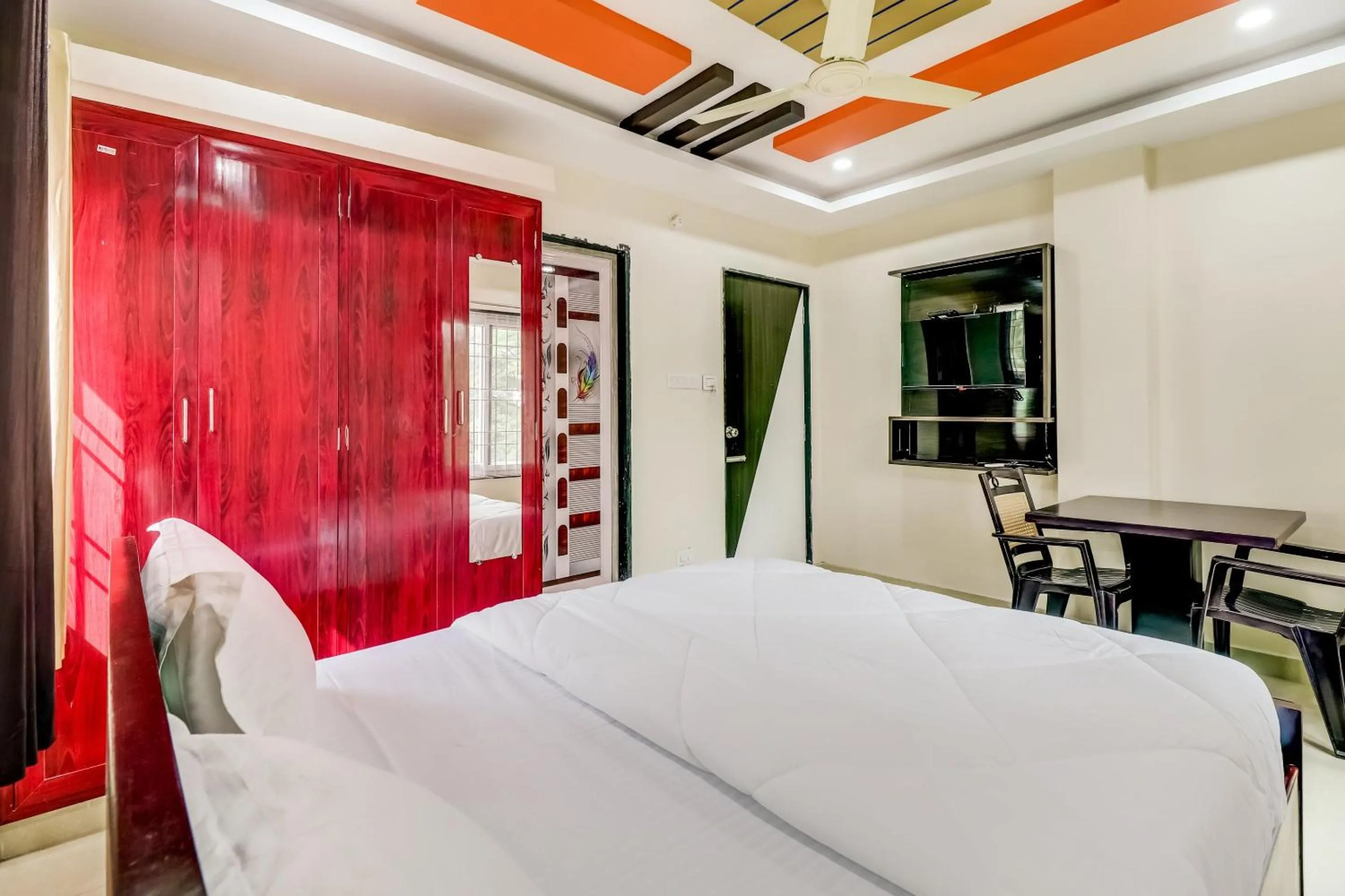 Bedroom in Hotel O Sri Singampalli Residency