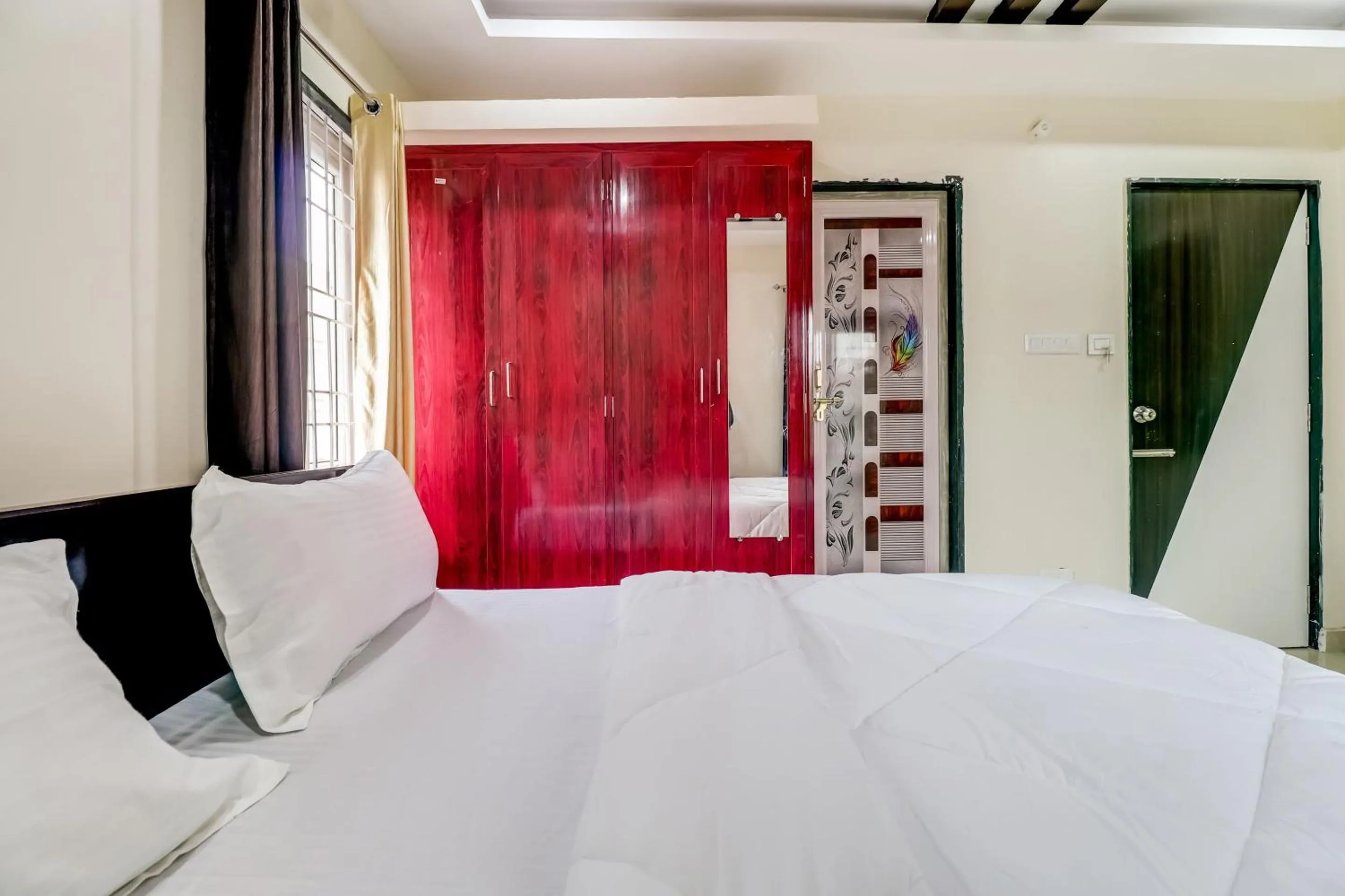 Bedroom in Hotel O Sri Singampalli Residency