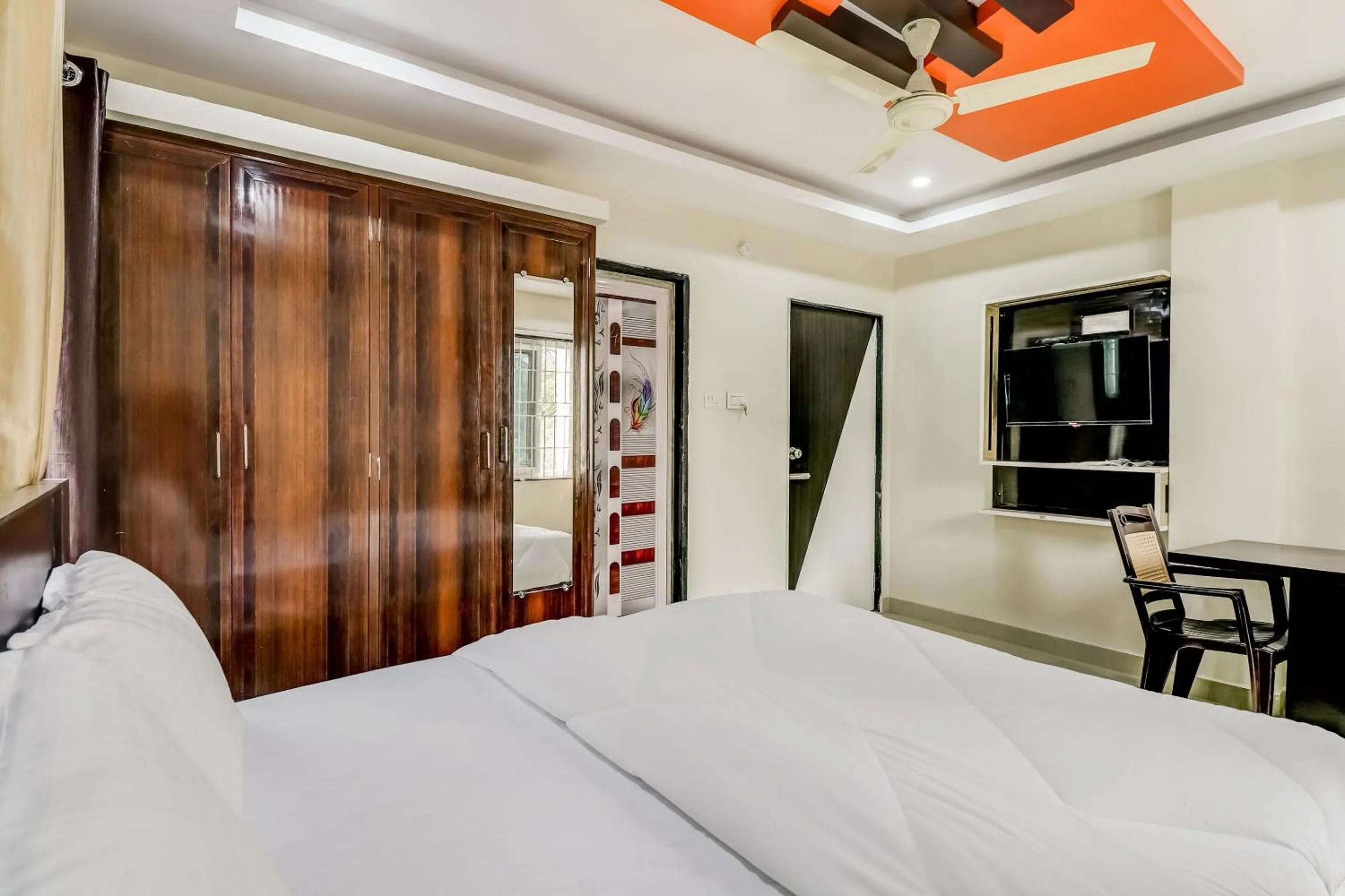 Bedroom in Hotel O Sri Singampalli Residency
