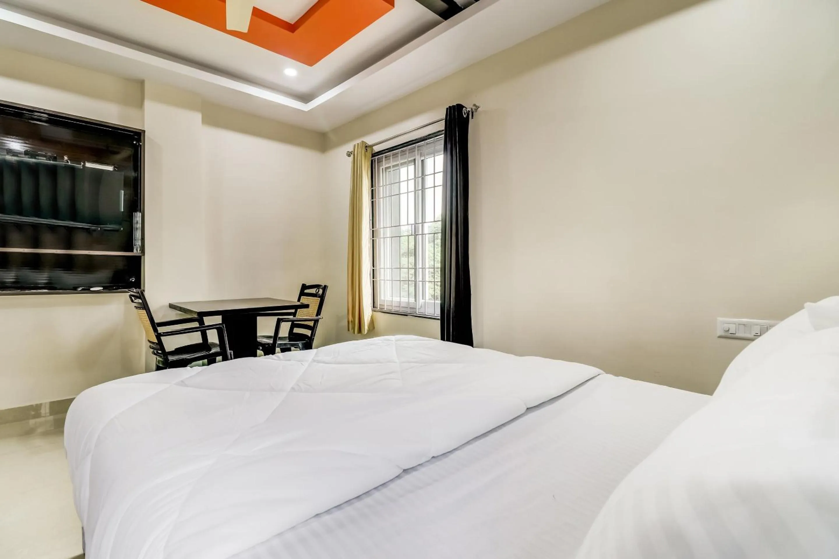 Bedroom in Hotel O Sri Singampalli Residency