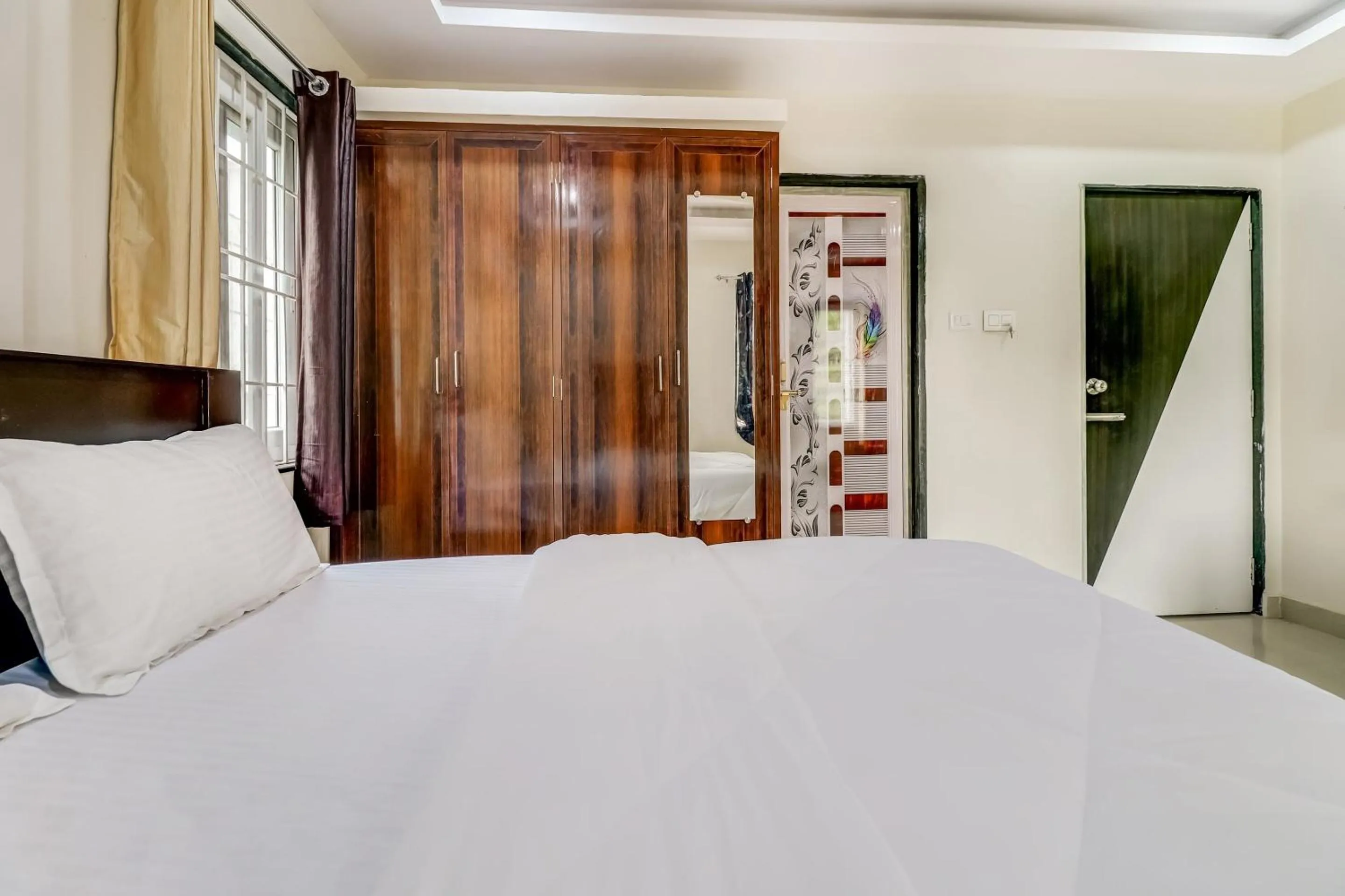 Bedroom in Hotel O Sri Singampalli Residency