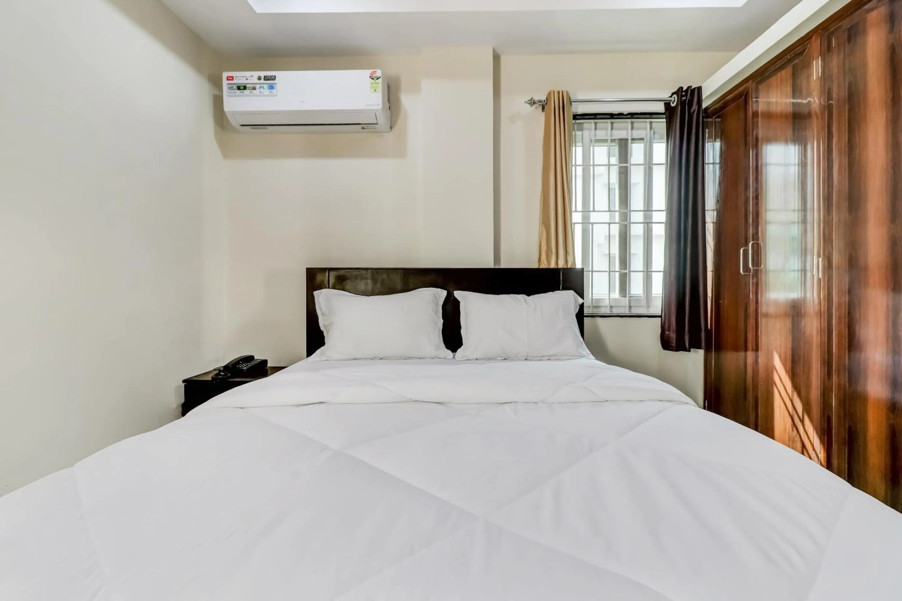 Bedroom in Hotel O Sri Singampalli Residency