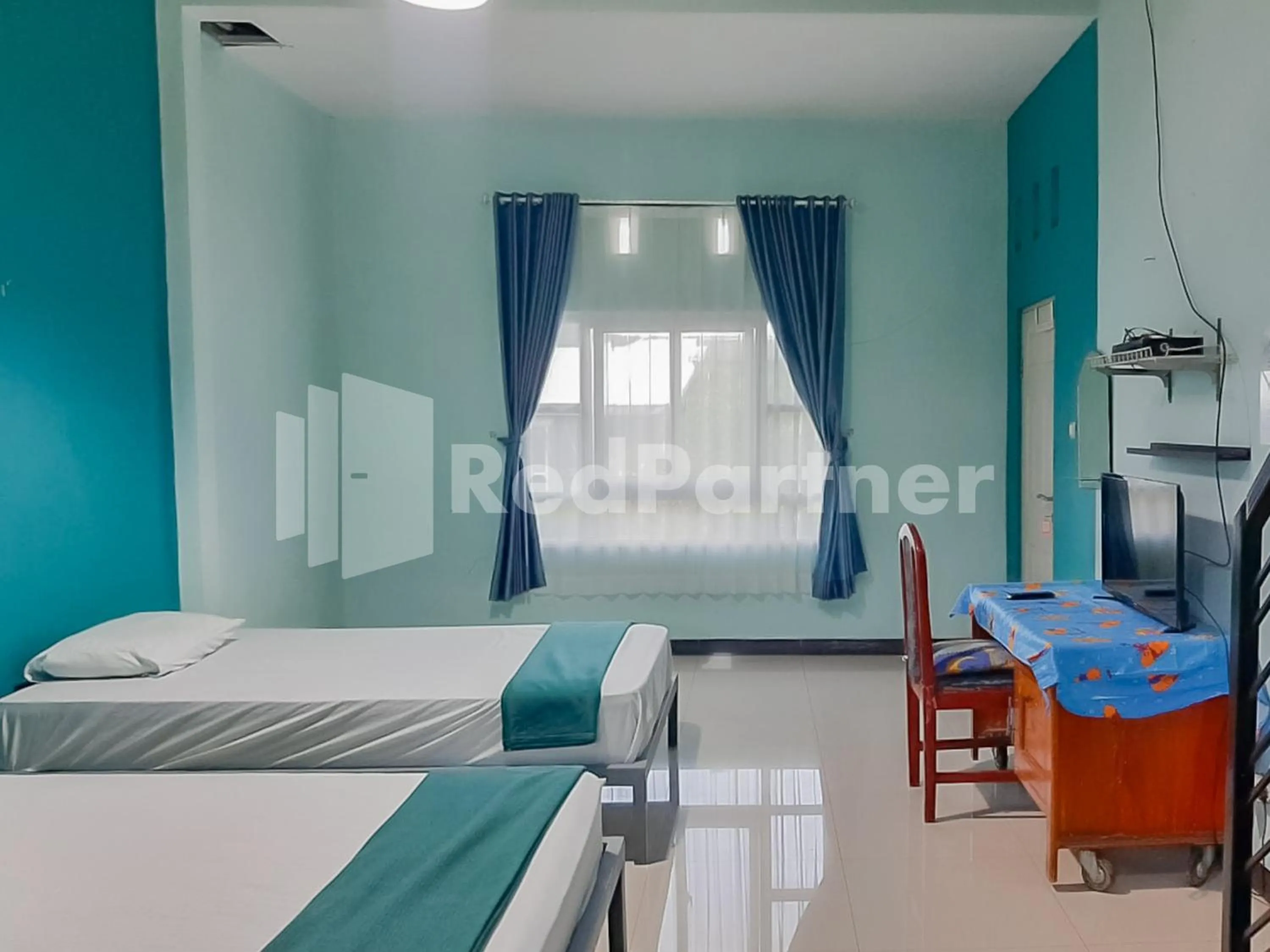 Bed in Syariah Safar Guest House Mitra RedDoorz