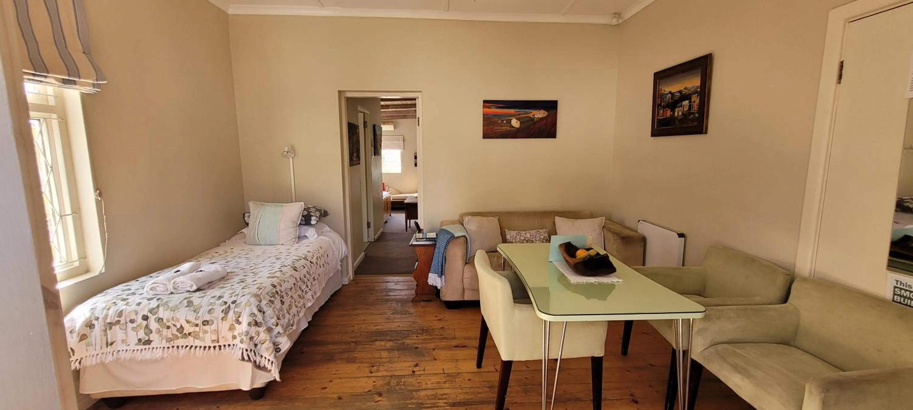 Seating area, Bed in AppleBee Guest Cottages