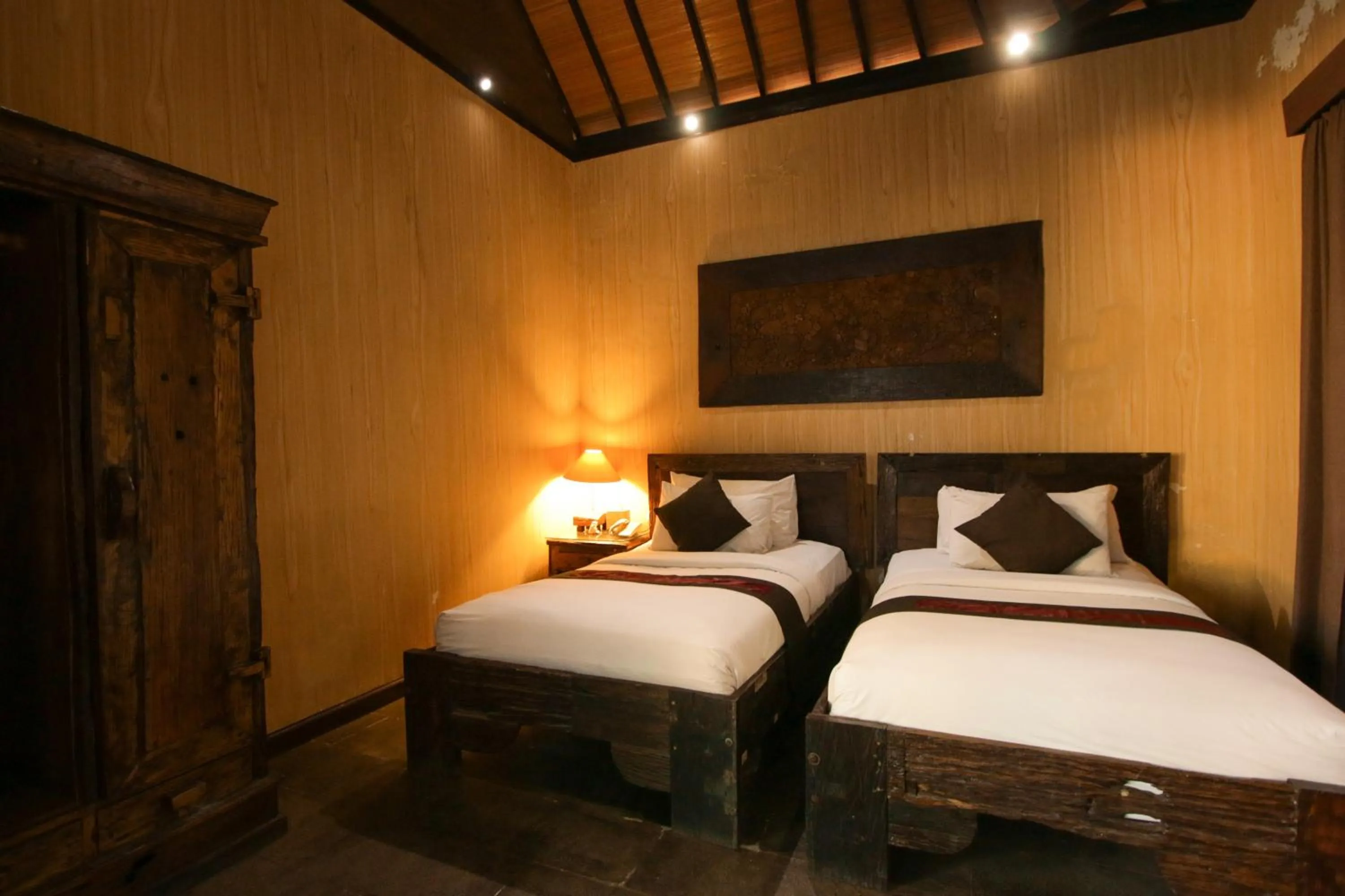 Bed in Gino Feruci Villa Ubud by KAGUM Hotels