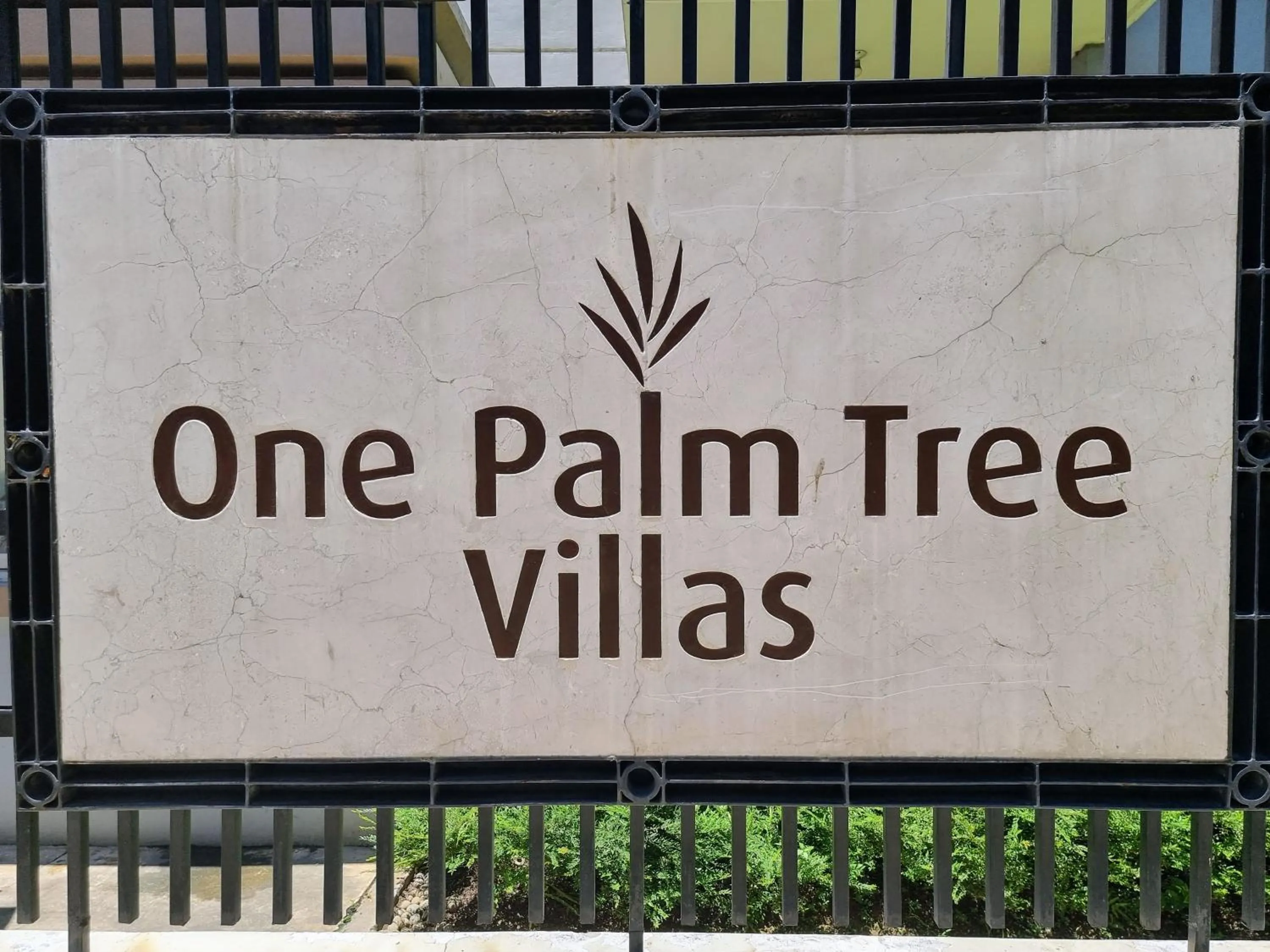 Property logo or sign in One Palm Tree Villas Condo Across NAIA Terminal 3