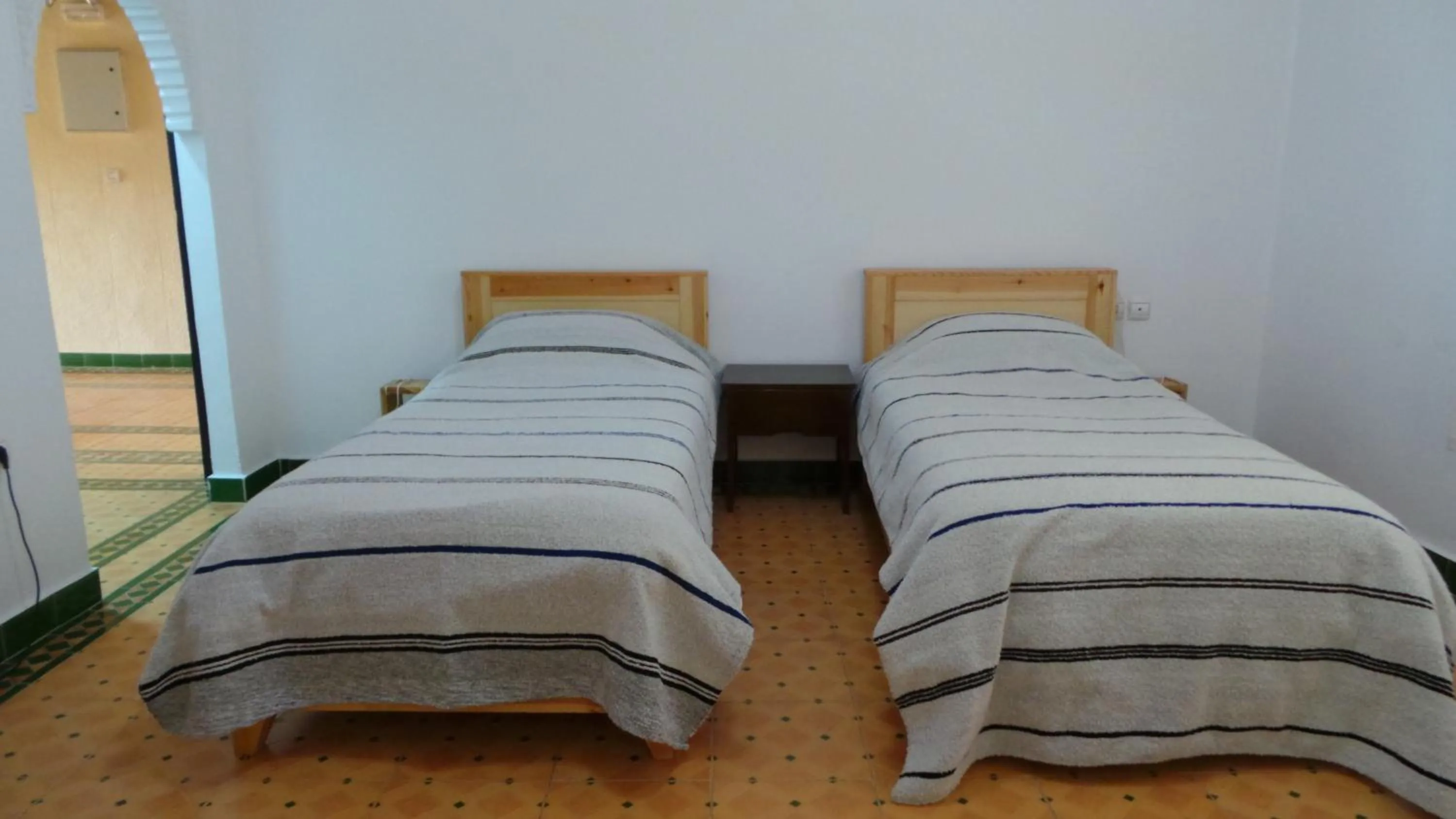 Photo of the whole room, Bed in Targafit Hotel & Hammam