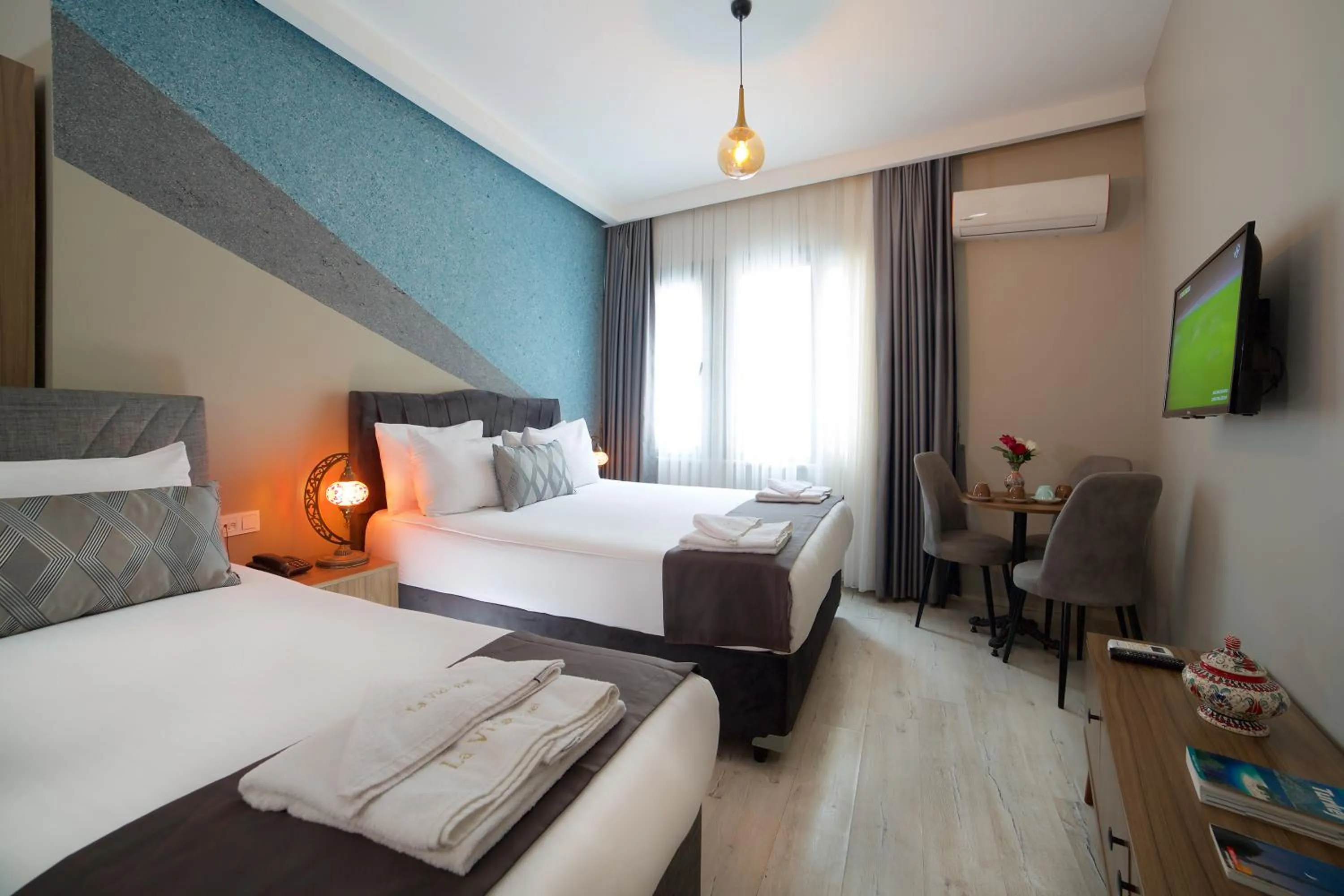 Bed in La Vida Old City Hotel