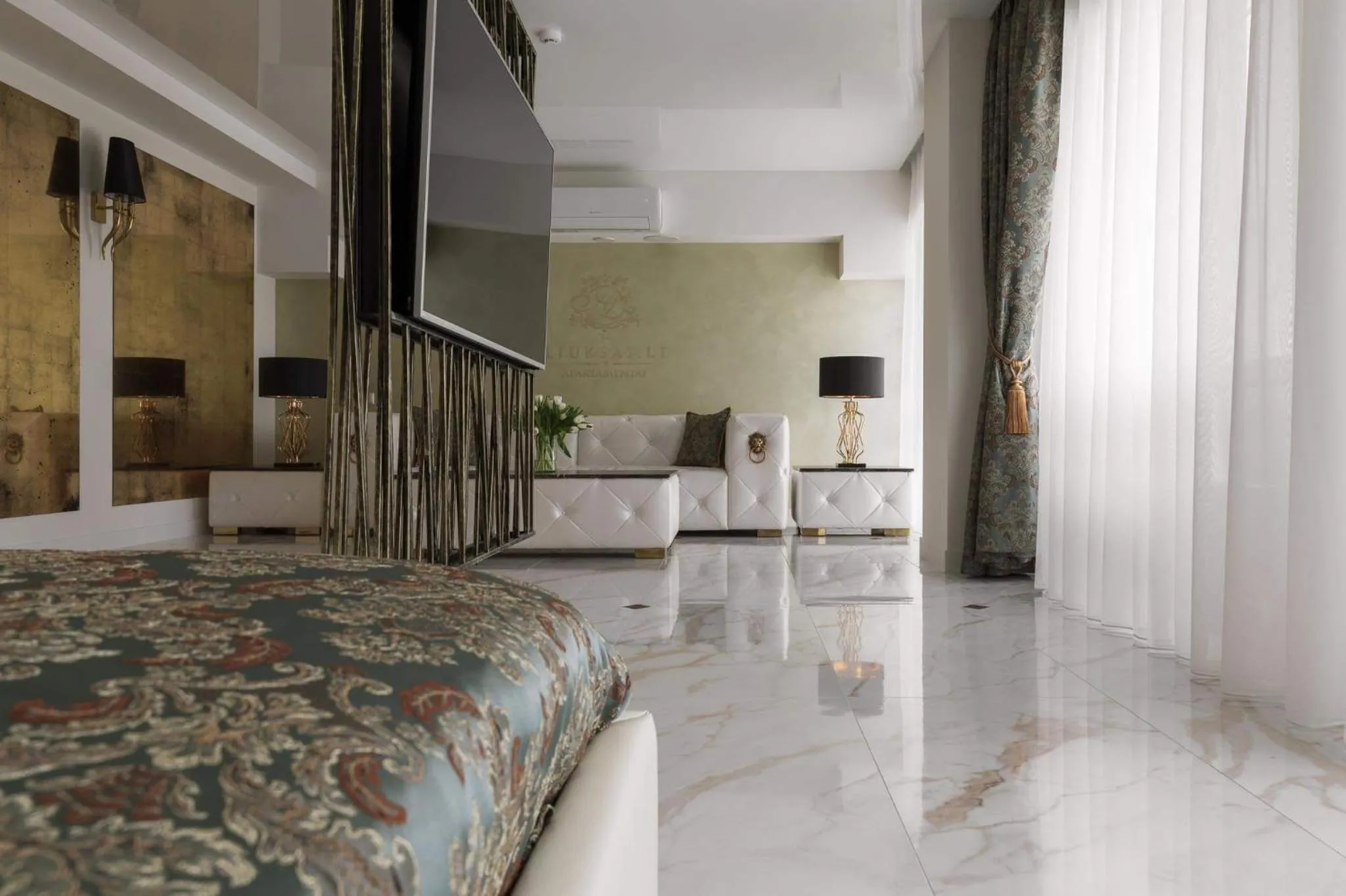 Bed in Prestige Jacuzzi Apartment by LIUKSAI