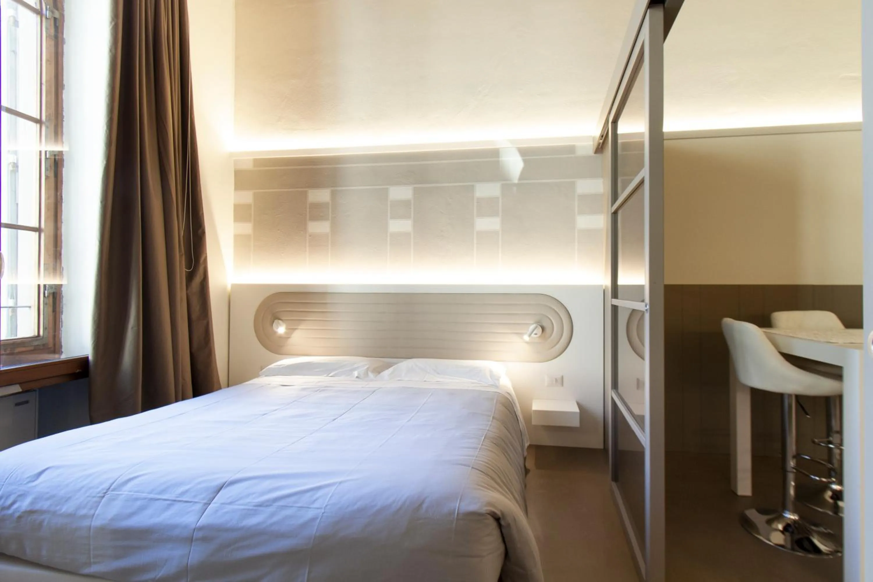 Bed in Palazzo dei Ciompi Suites