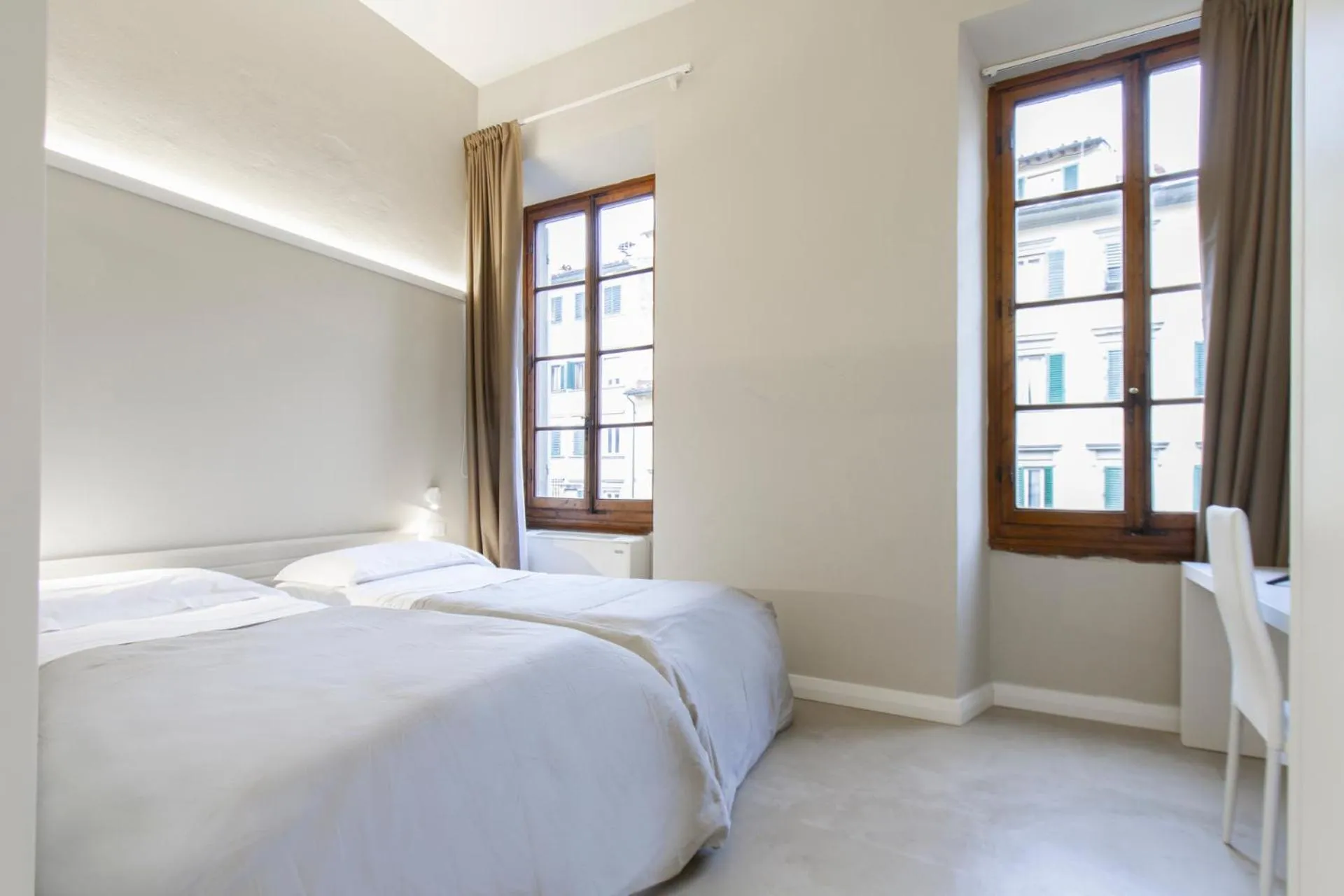 Bed in Palazzo dei Ciompi Suites