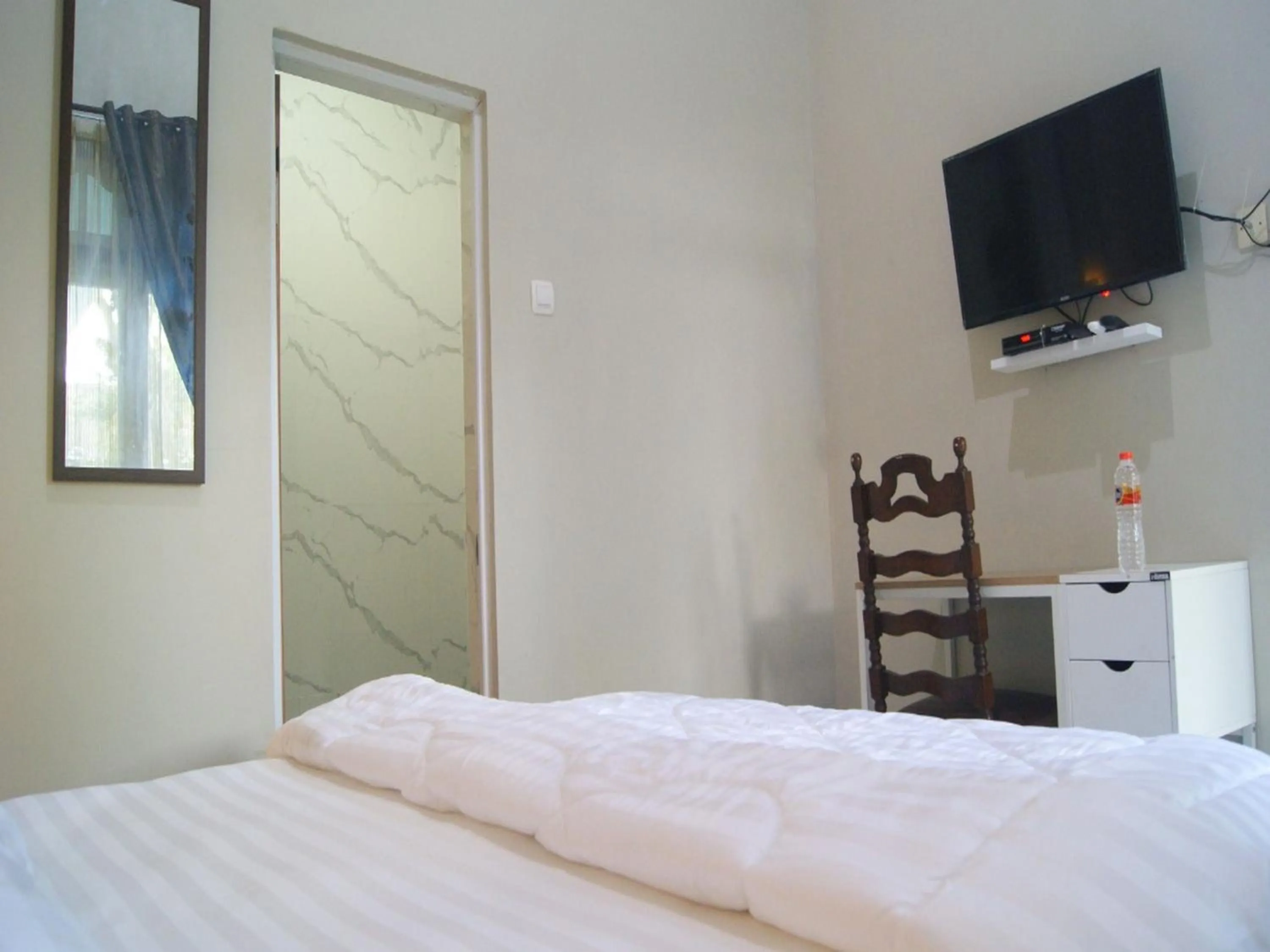 Bed in Jazz Room Kampung Inggris Syariah