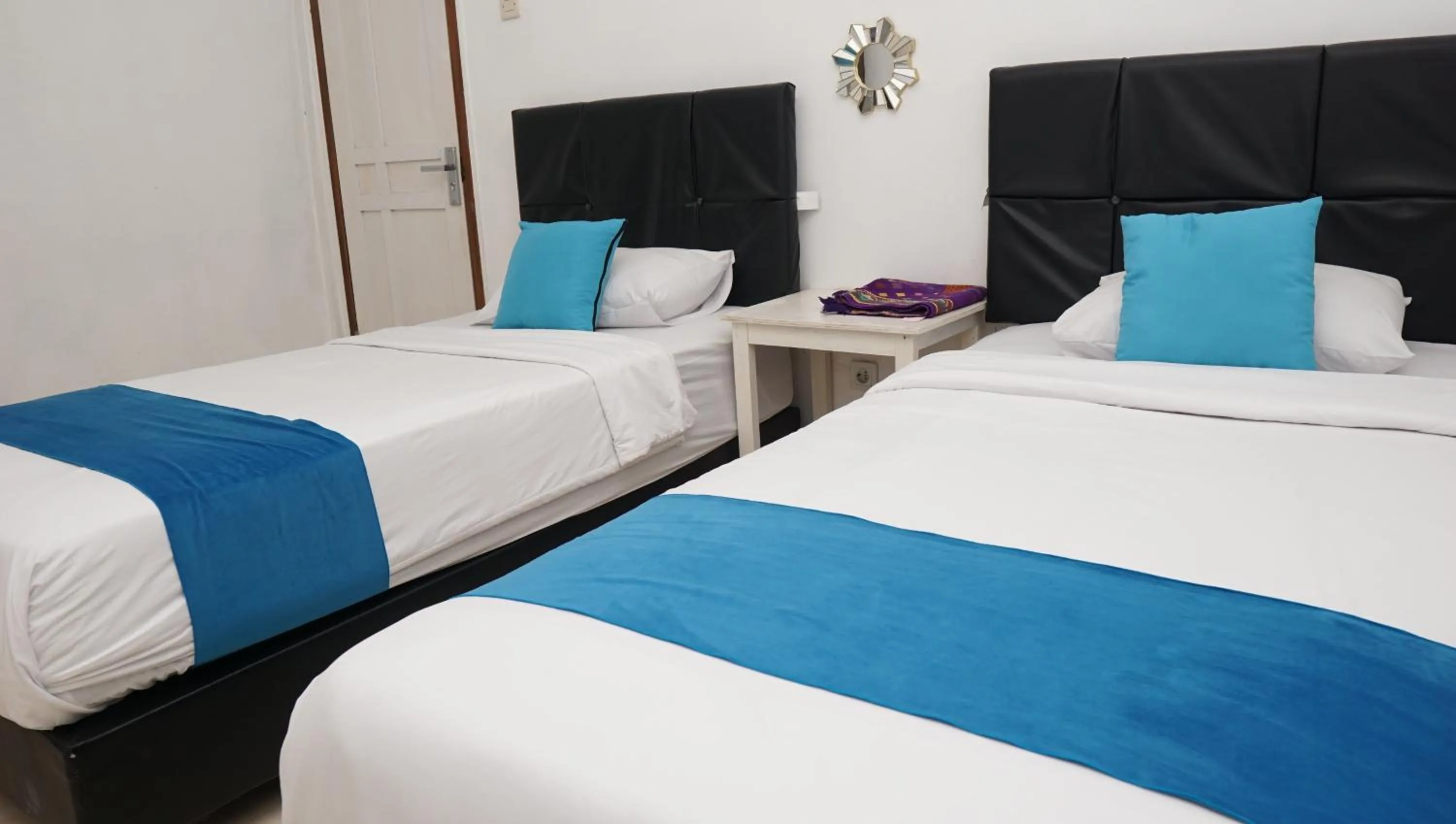 Bed in Jazz Room Kampung Inggris Syariah