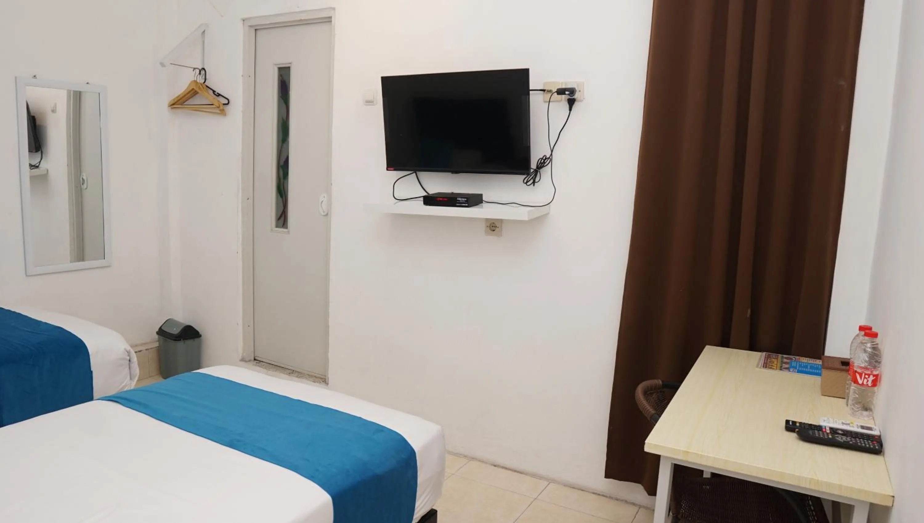 Bed in Jazz Room Kampung Inggris Syariah