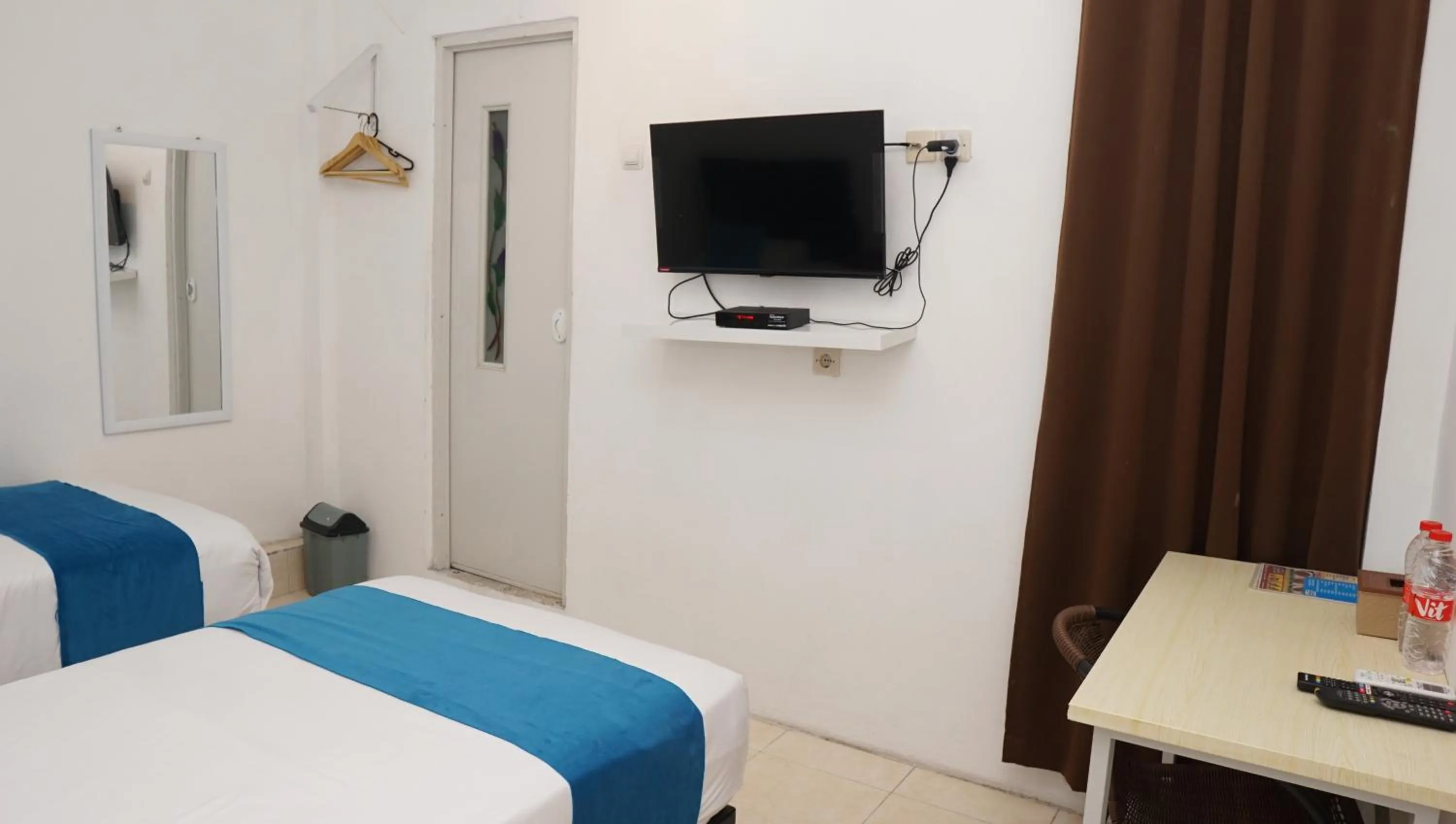 Bed in Jazz Room Kampung Inggris Syariah