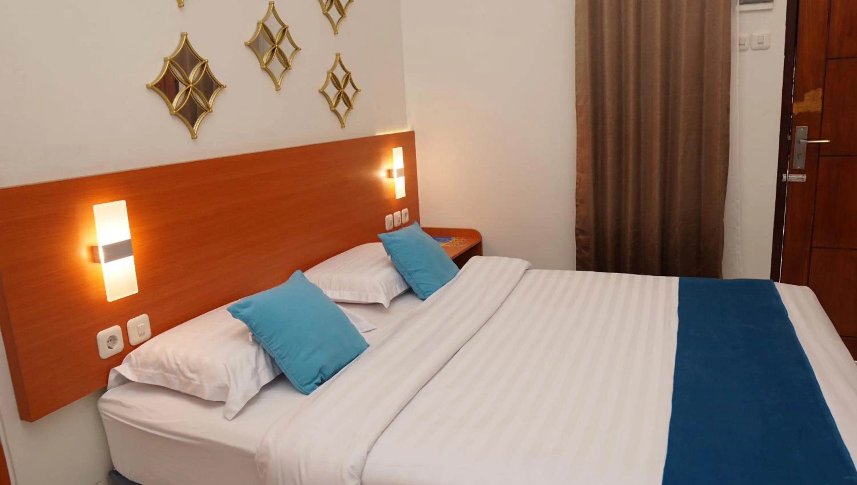 Bed in Jazz Room Kampung Inggris Syariah