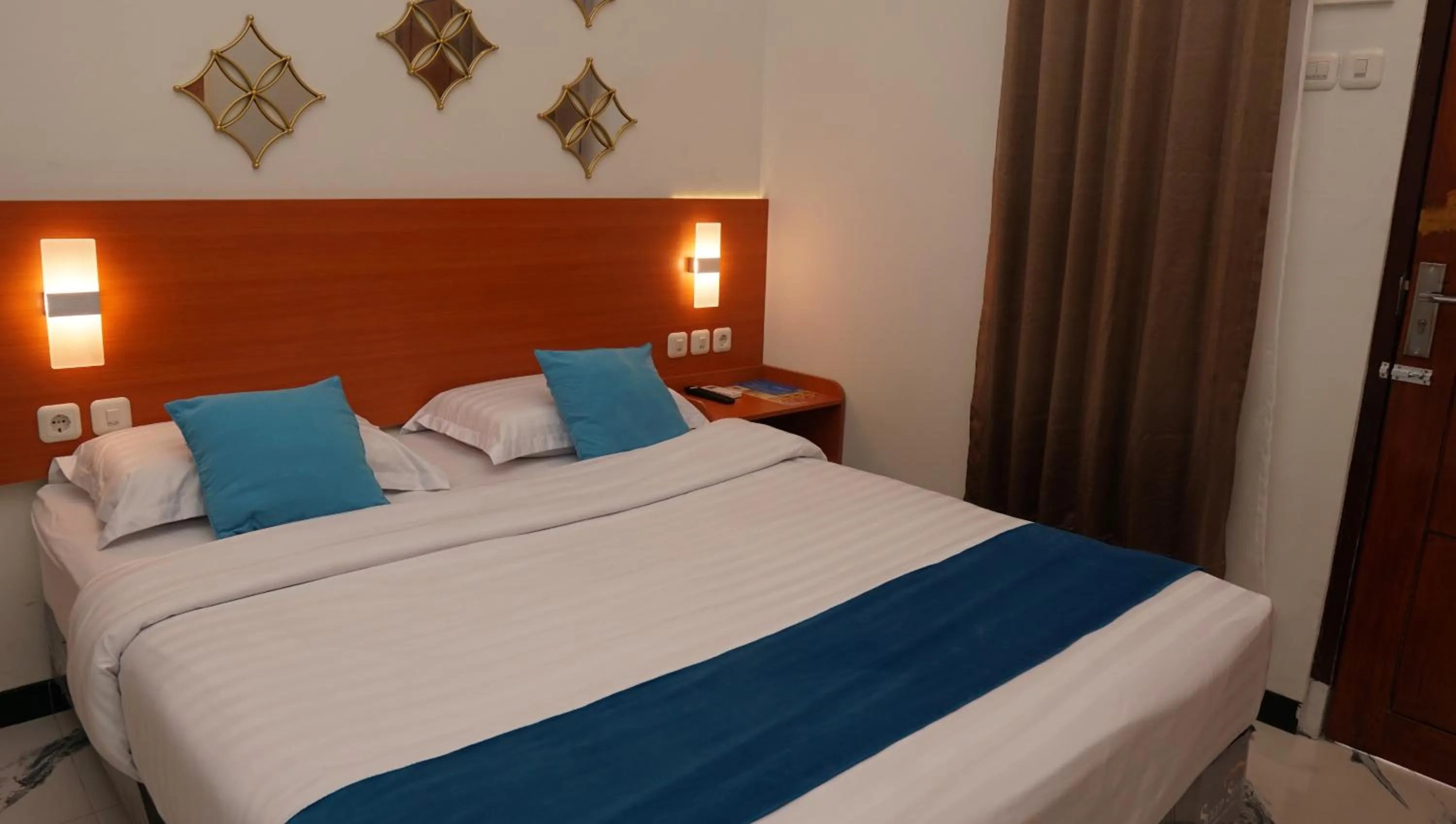 Bed in Jazz Room Kampung Inggris Syariah