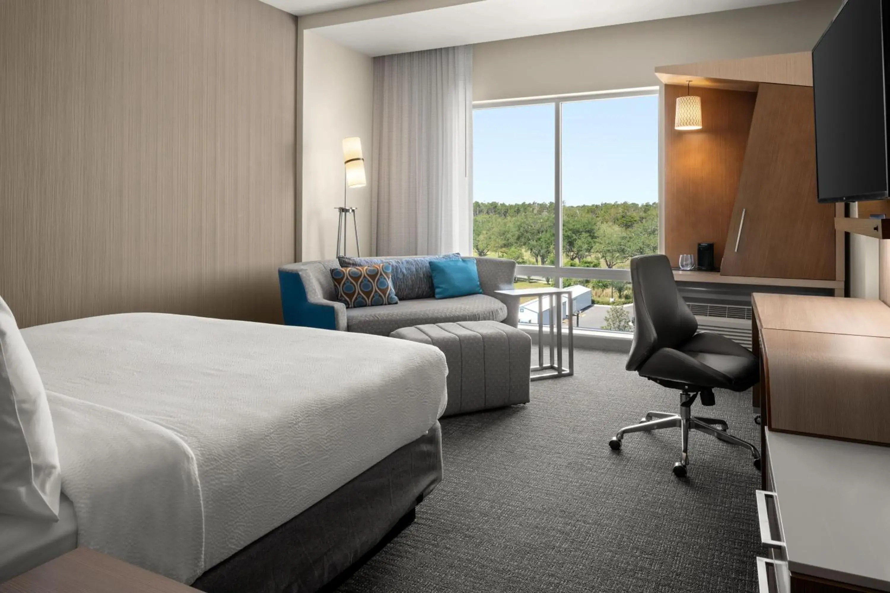 King Room with Sofa Bed - Hearing Accessible in Courtyard By Marriott Titusville Kennedy Space Center King Room with Sofa Bed - Hearing Accessible in Courtyard By Marriott Titusville Kennedy Space Center