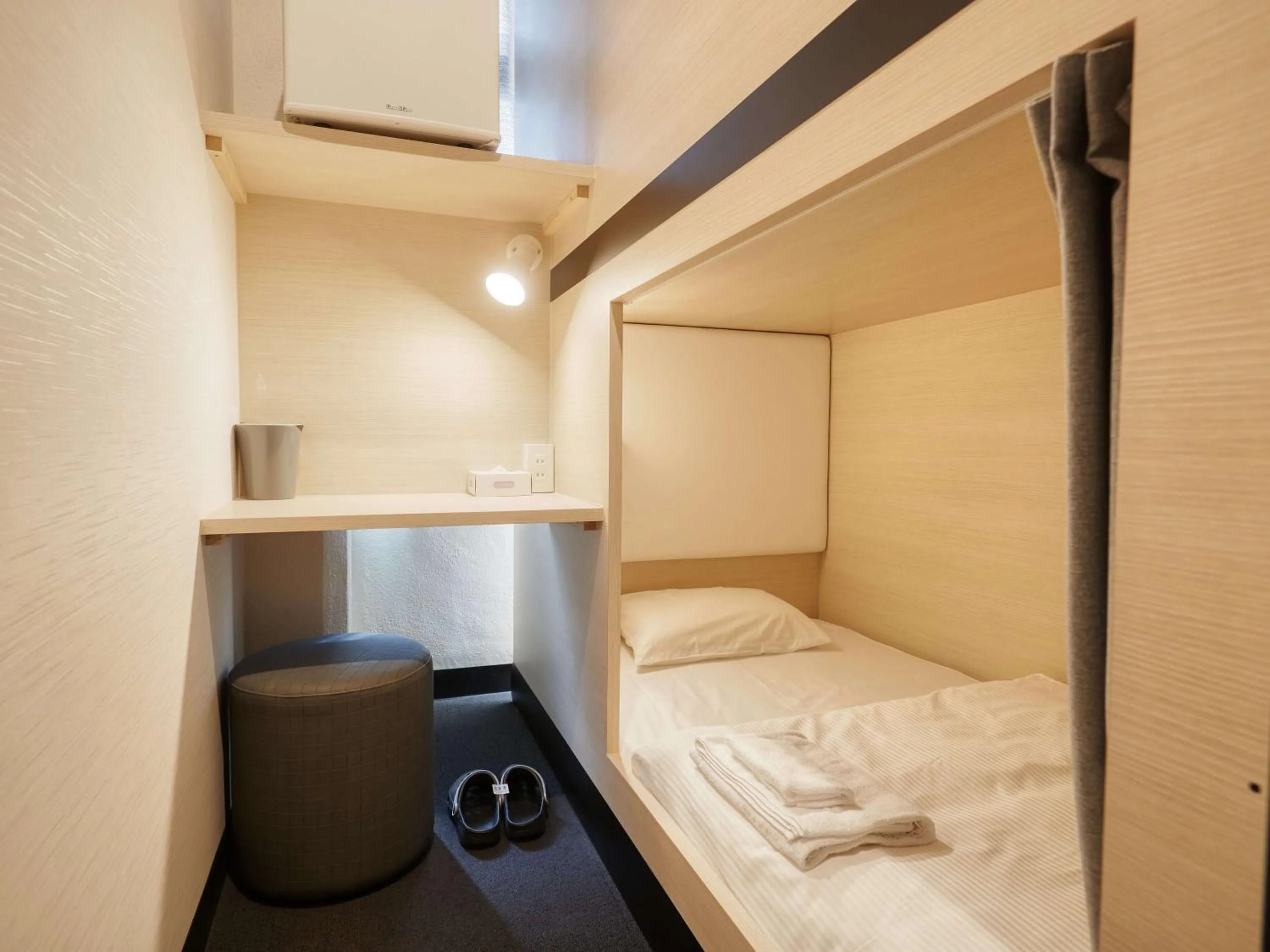 Bed in CABIN&HOTEL CONSTANT NAHA