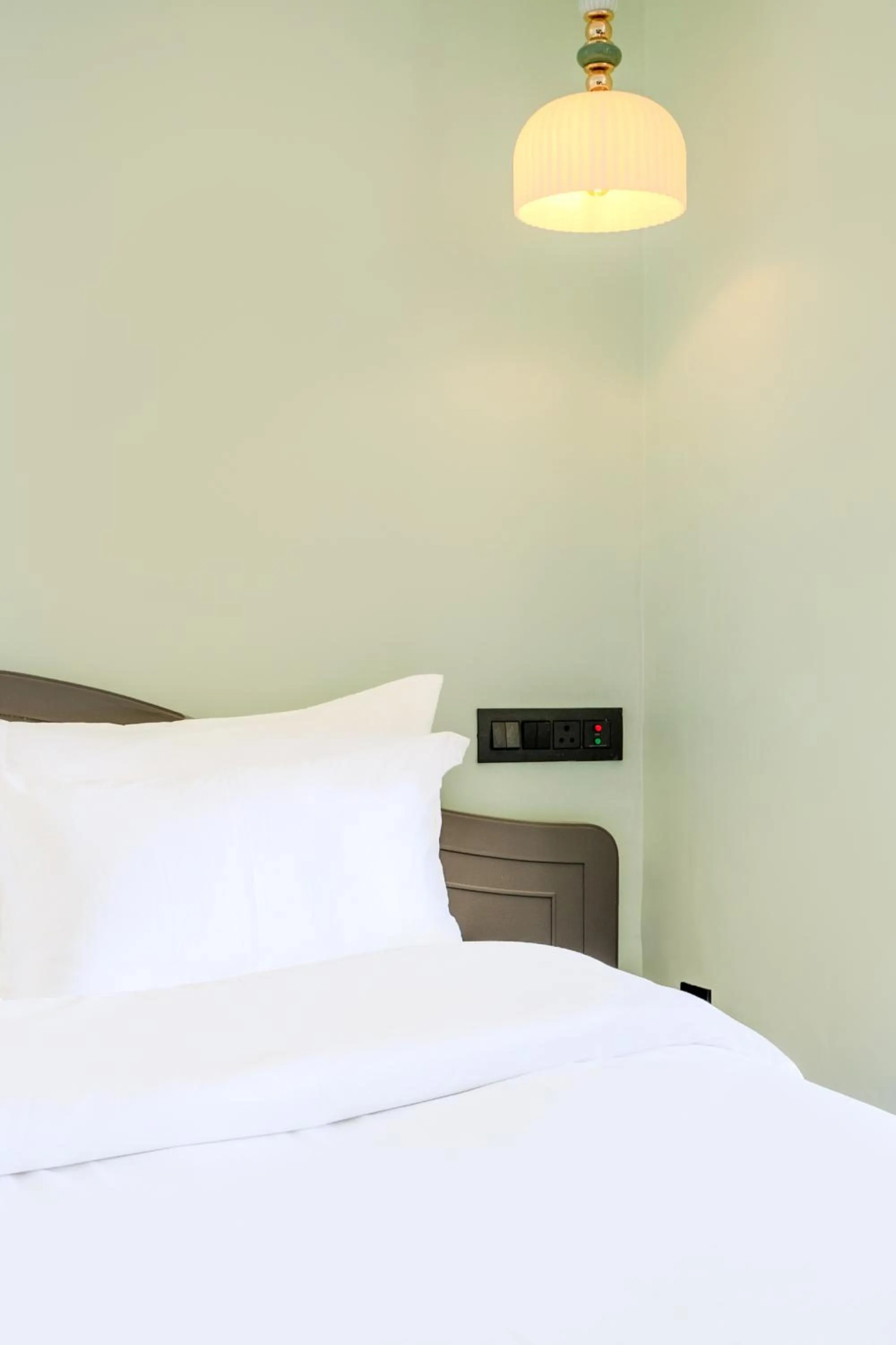 Bed in Girisadan - A City Centre Boutique Hotel