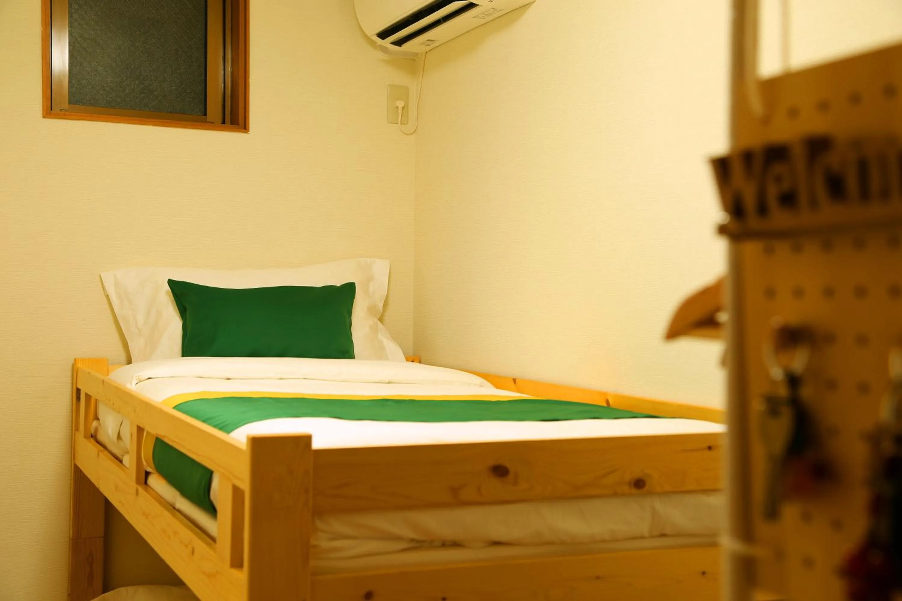 Bed in E JOY INN-West Shinjuku Branch