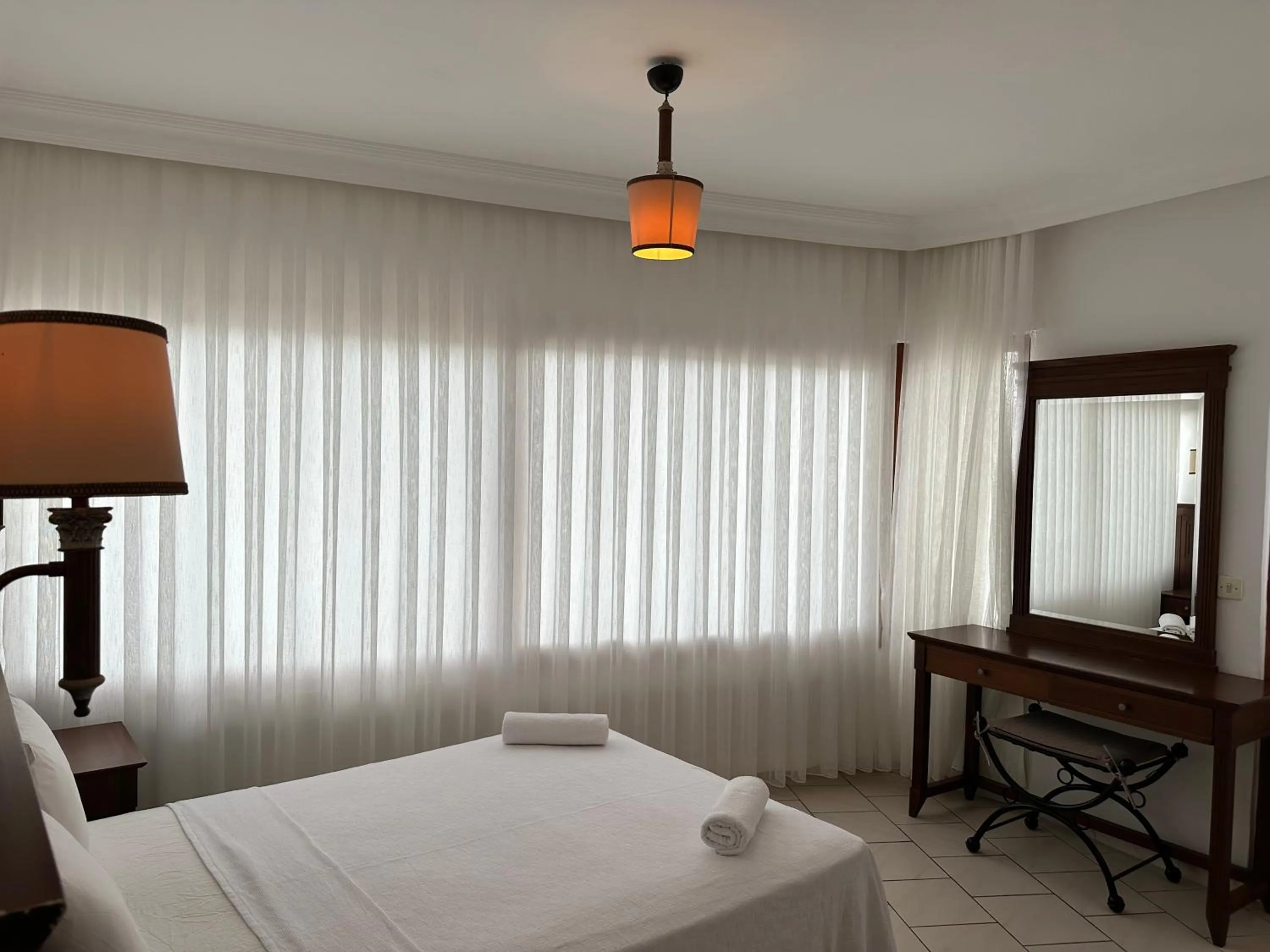 Bed in NATURELLA APART HOTEL