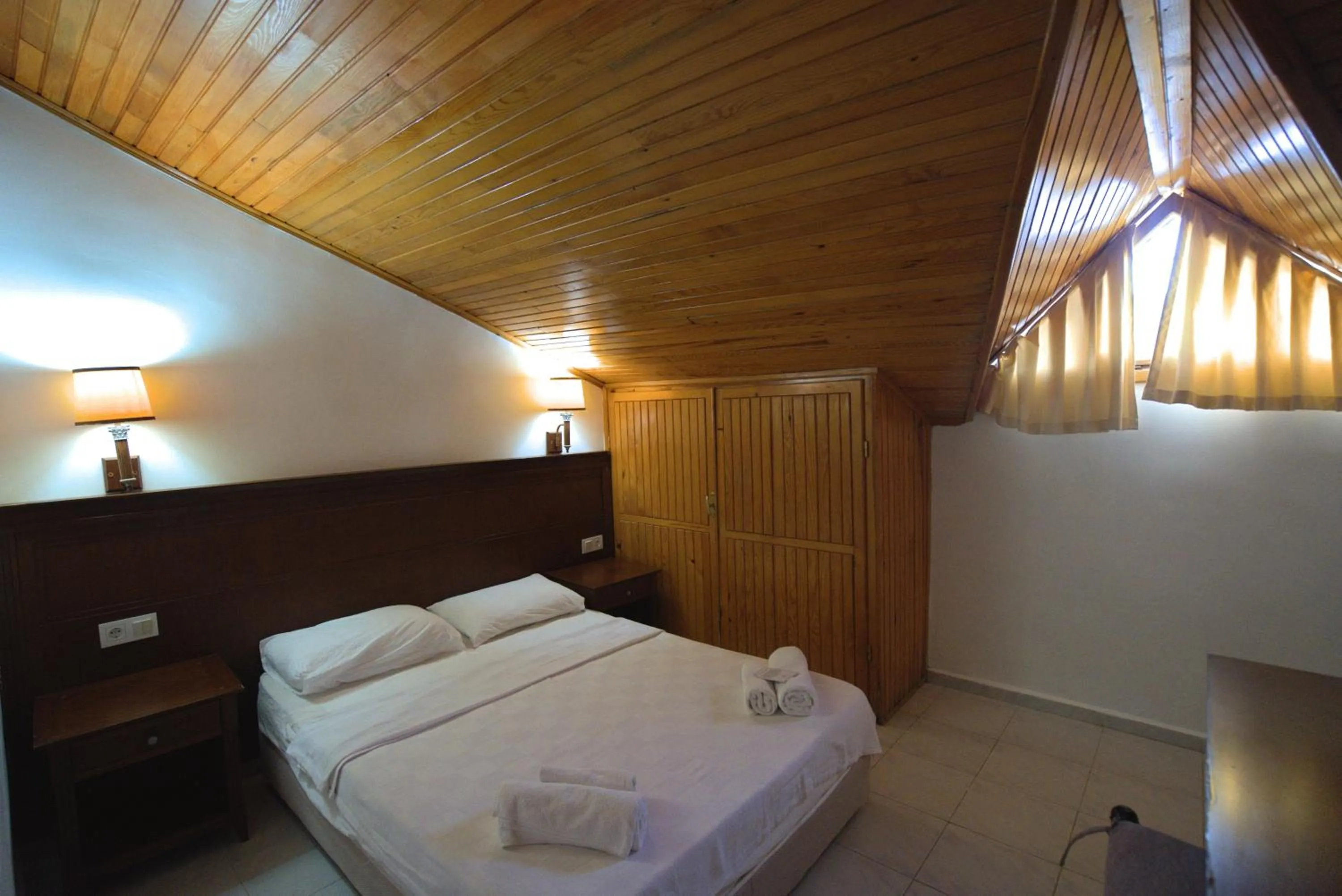 Bed in NATURELLA APART HOTEL