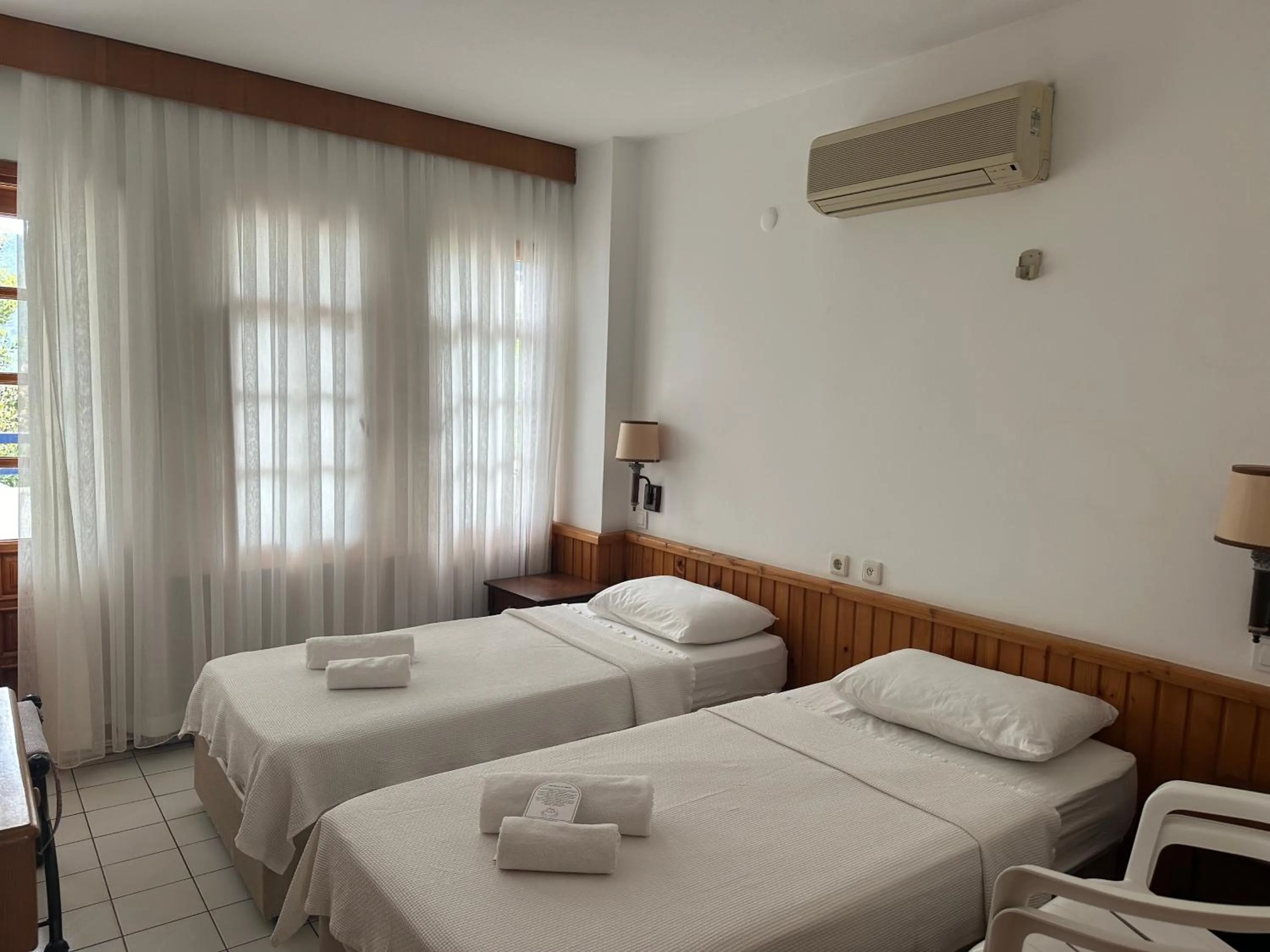 Bed in NATURELLA APART HOTEL