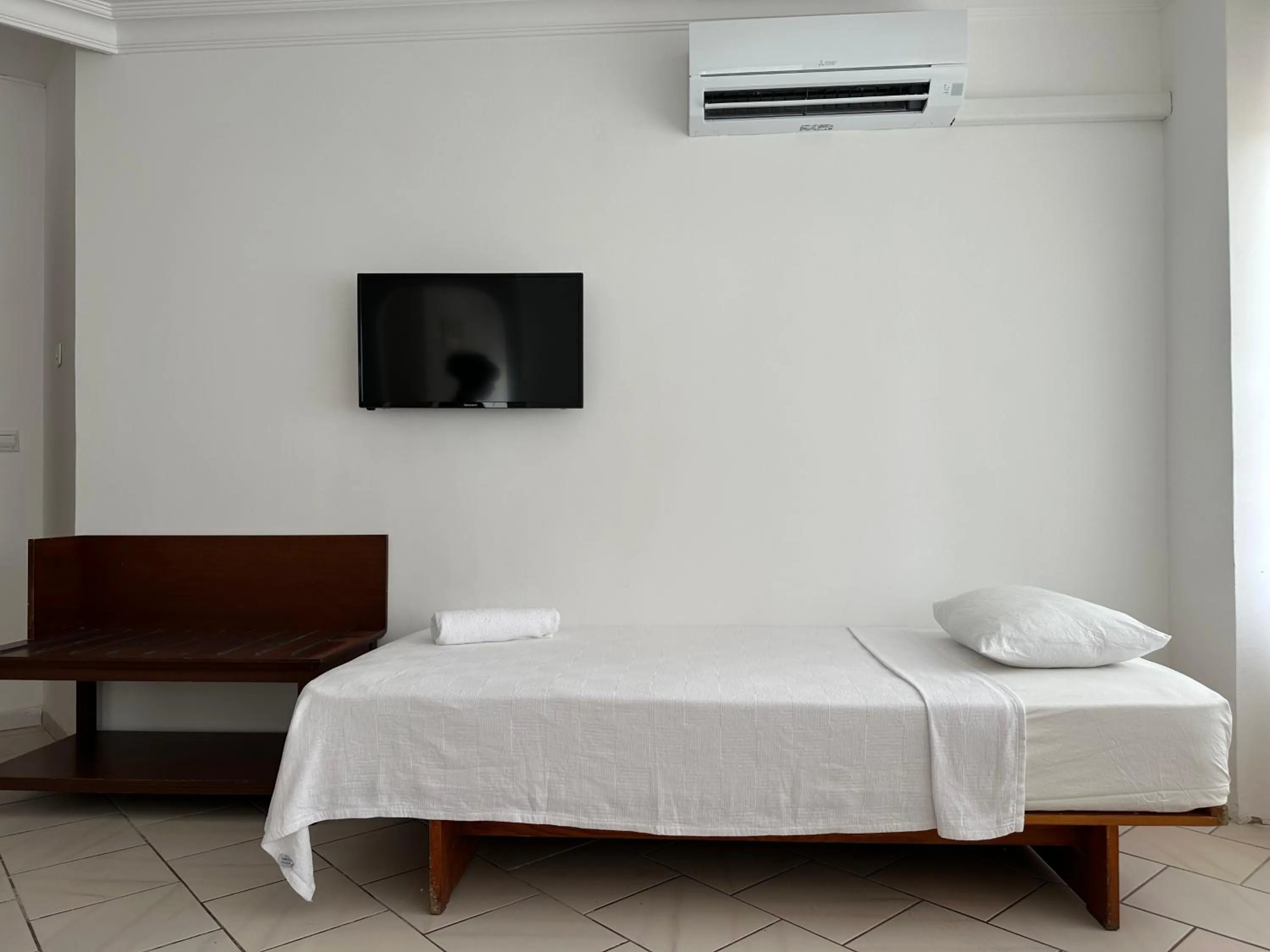 Bed in NATURELLA APART HOTEL