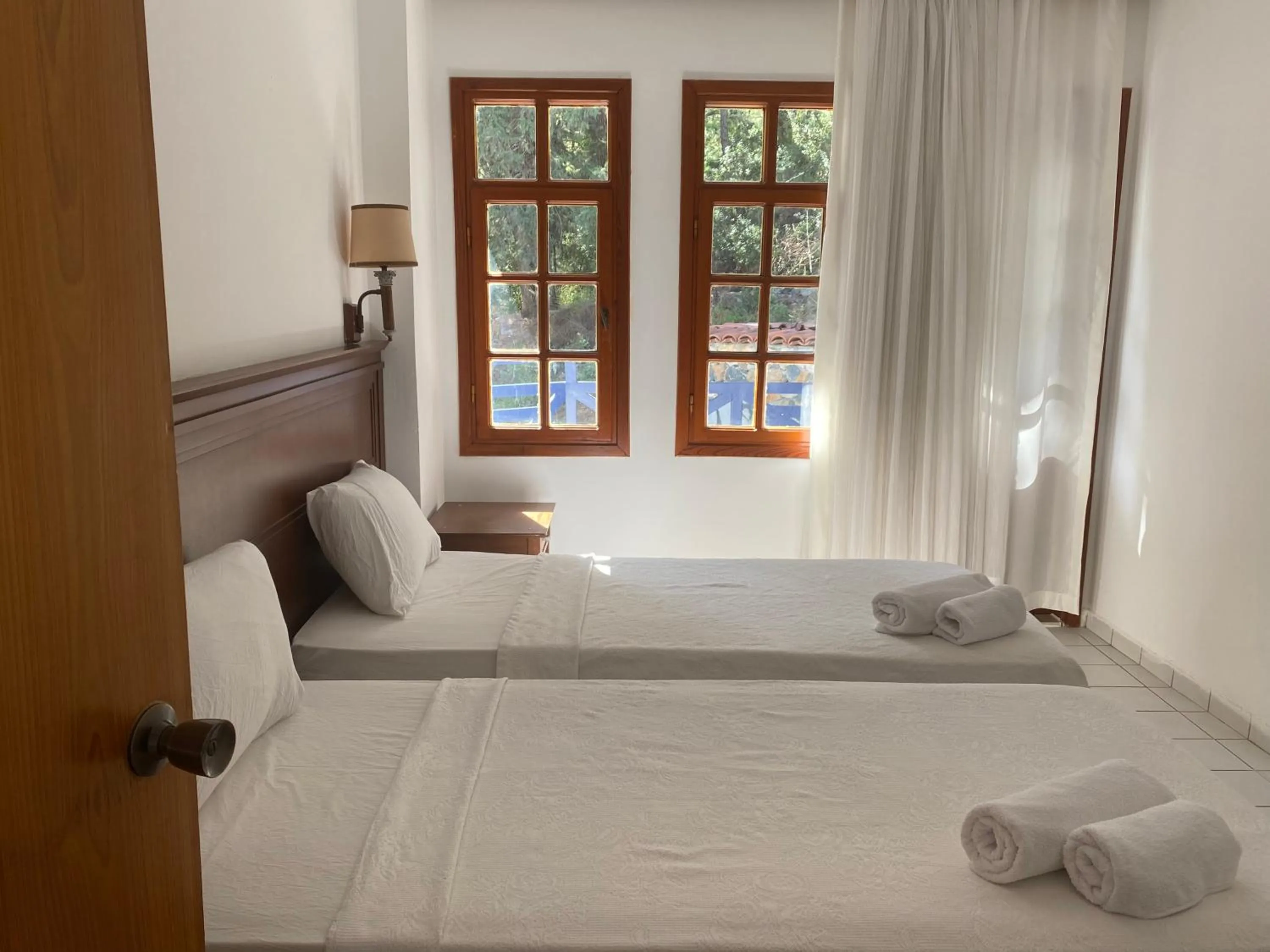 Bed in NATURELLA APART HOTEL