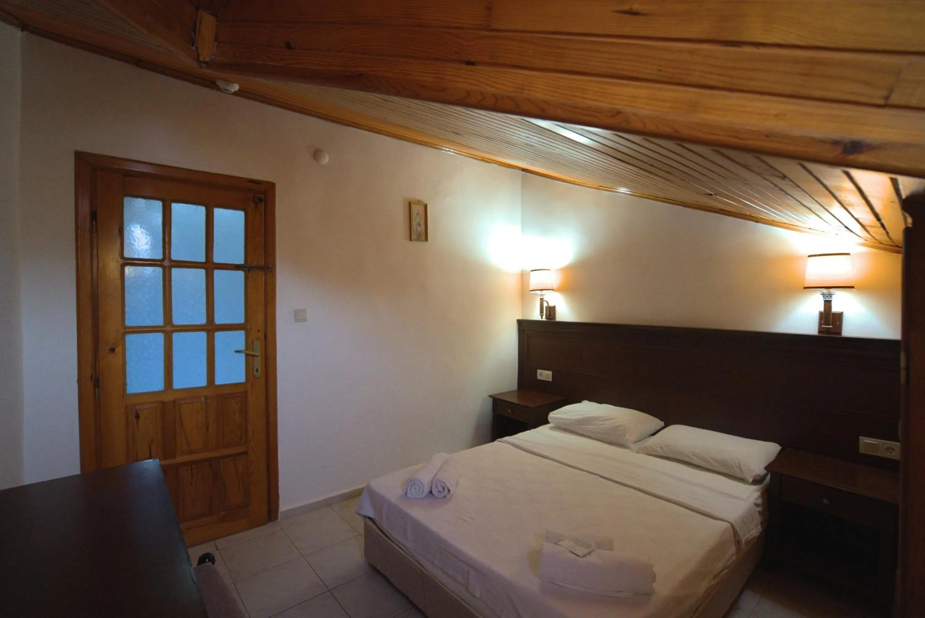 Bed in NATURELLA APART HOTEL