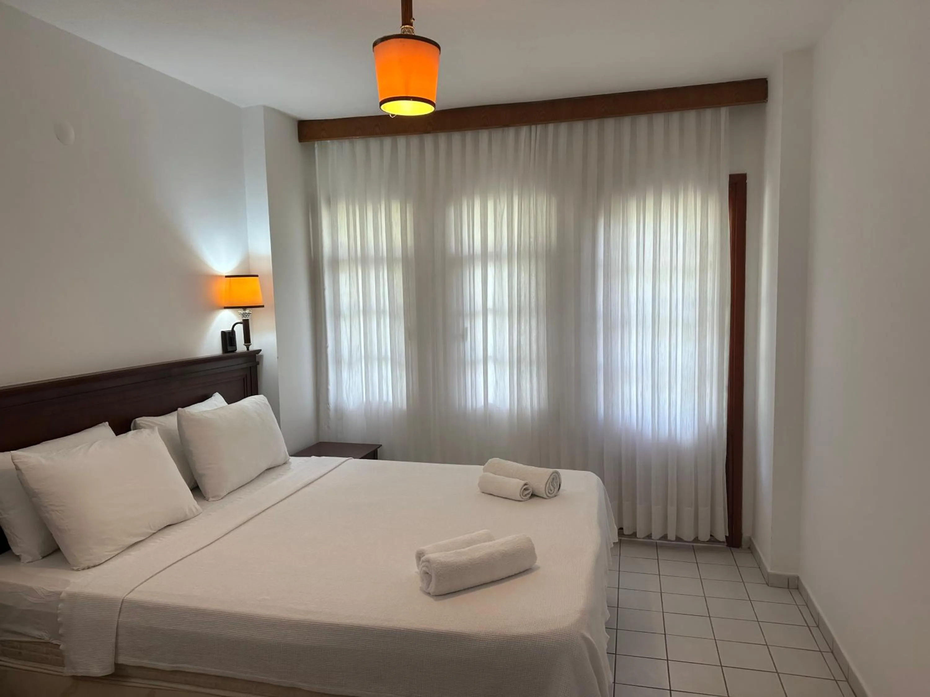 Bed in NATURELLA APART HOTEL