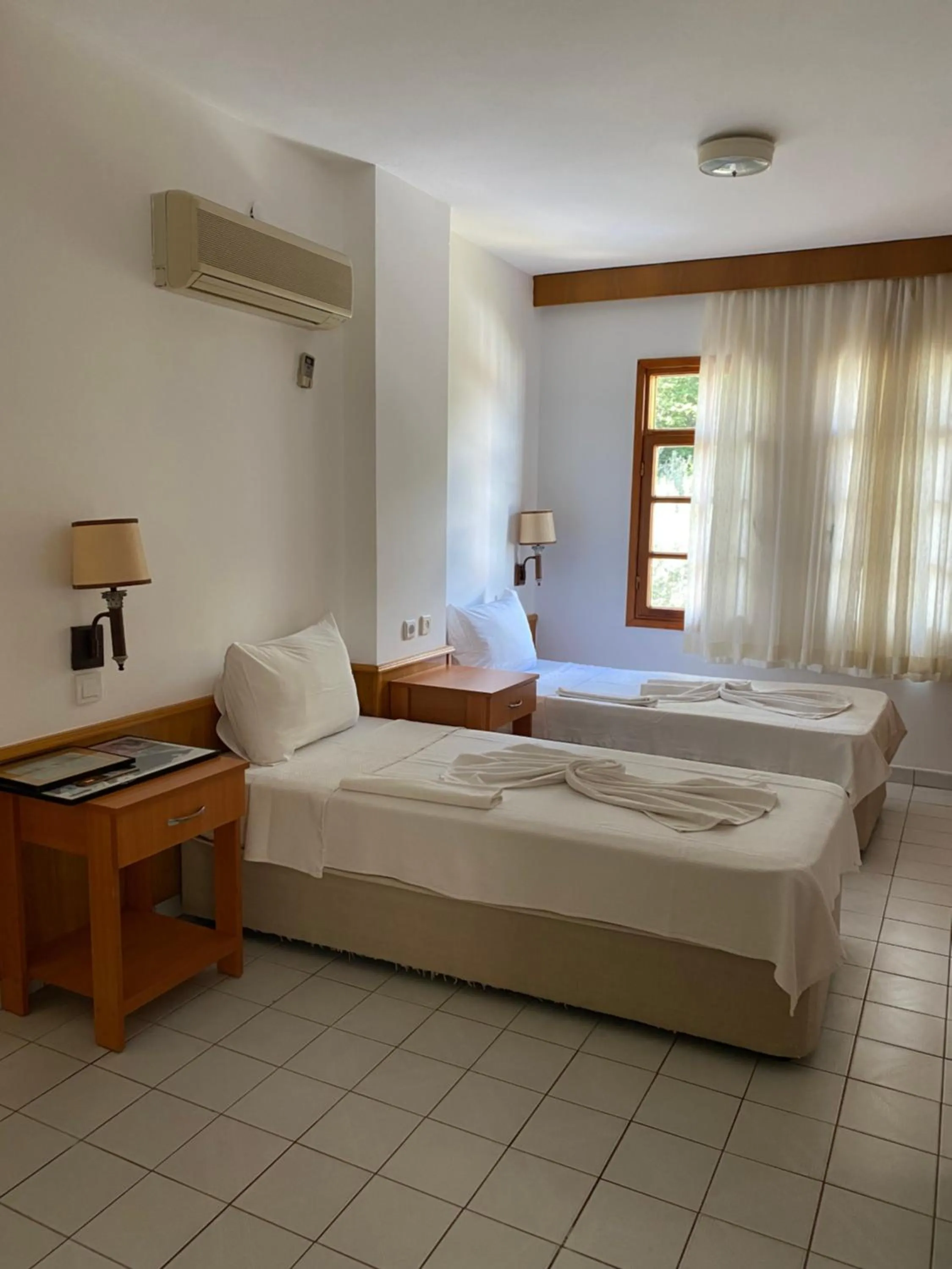 Bed in NATURELLA APART HOTEL