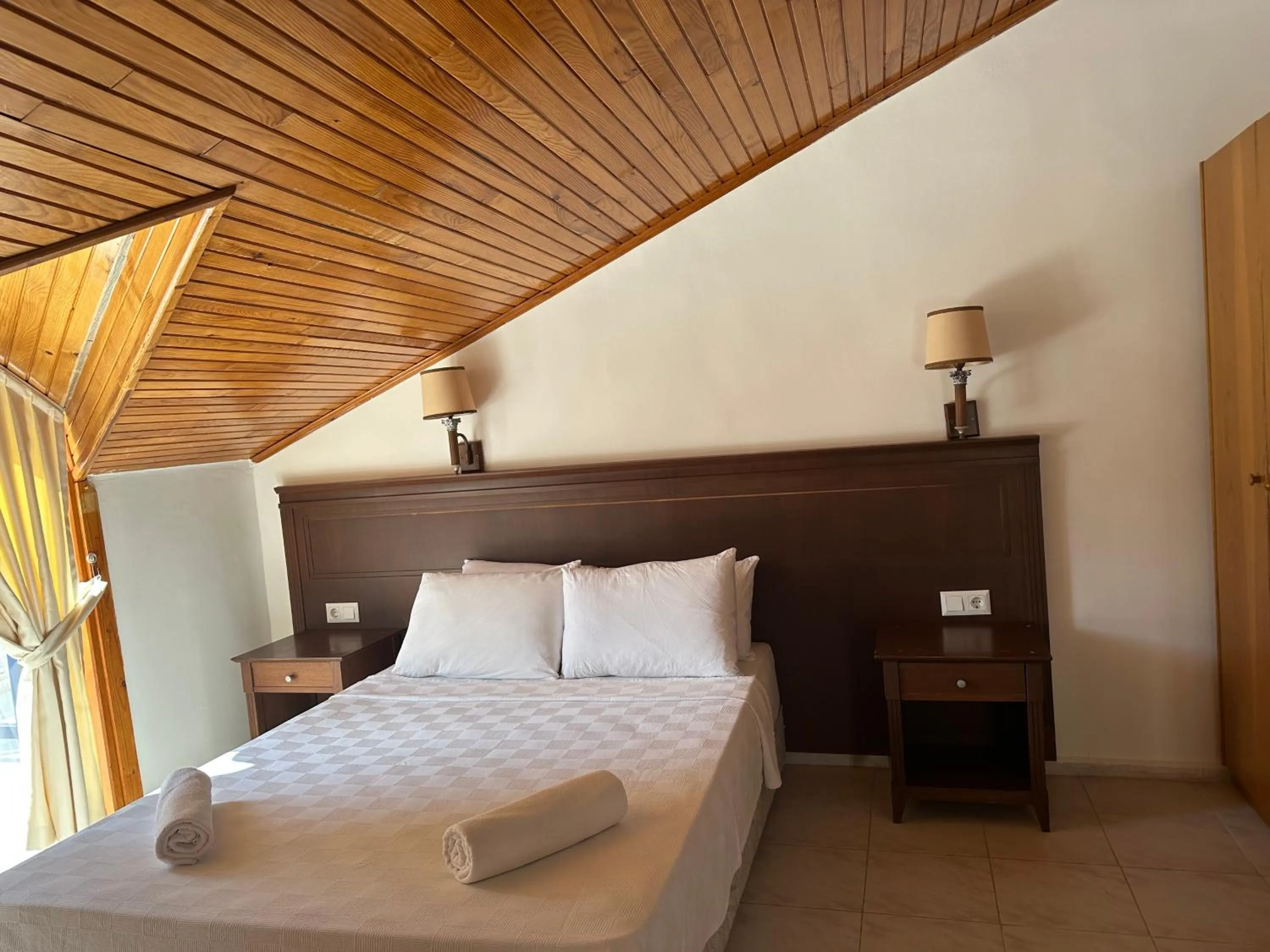 Bed in NATURELLA APART HOTEL