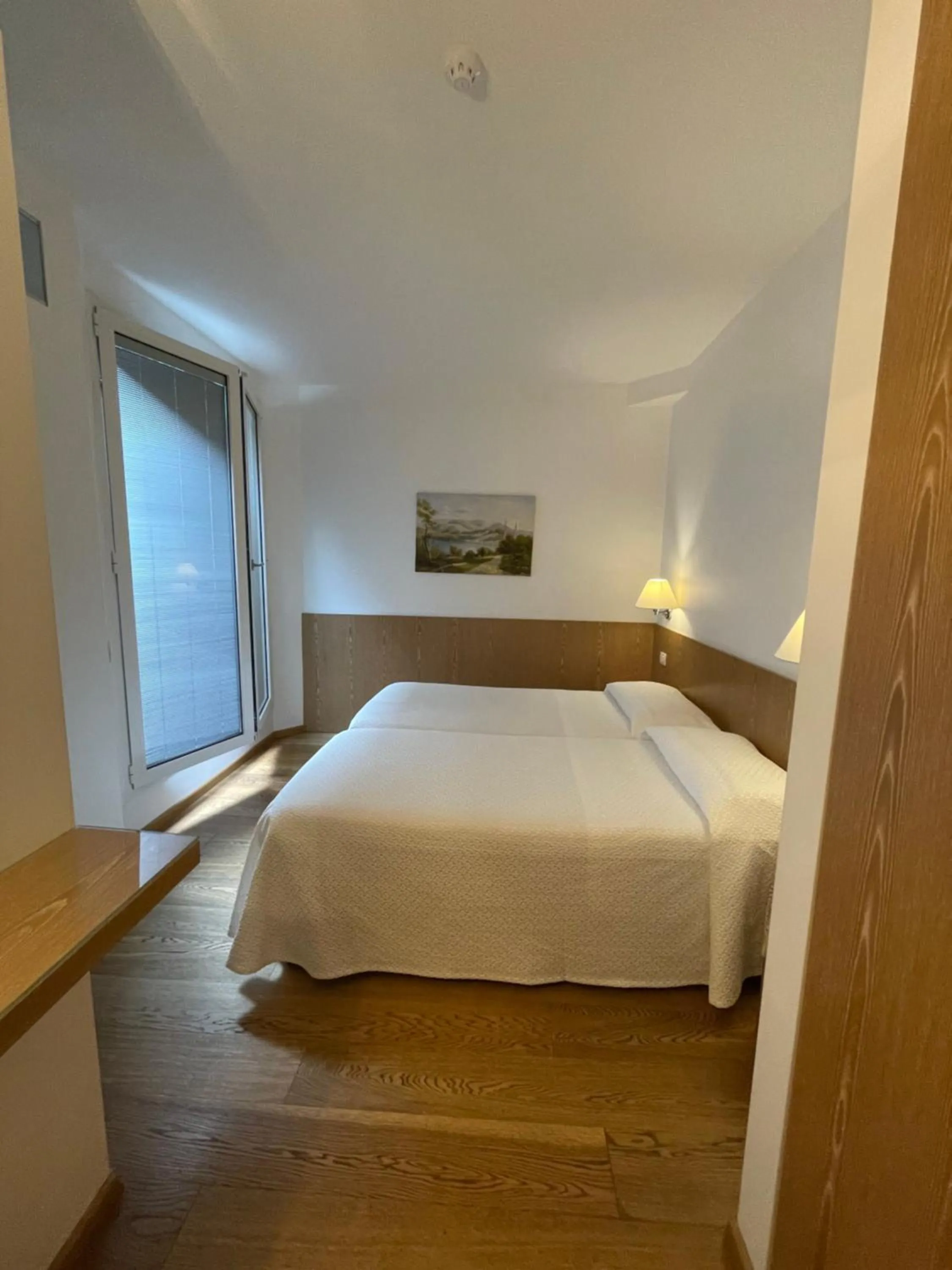 Bed in Hotel Metropole Suisse