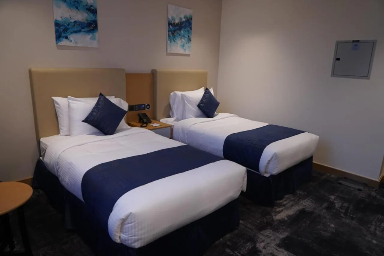 Bed in AL HAYAT HOTEL