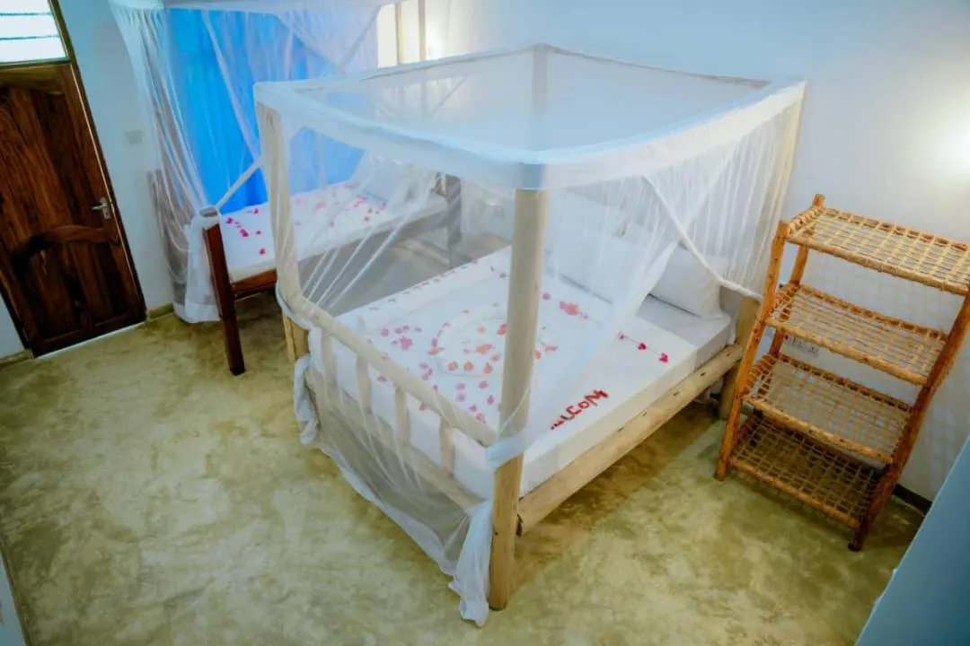 Bed in Serenity Boutique Hotel, Tanzania Unforgettable