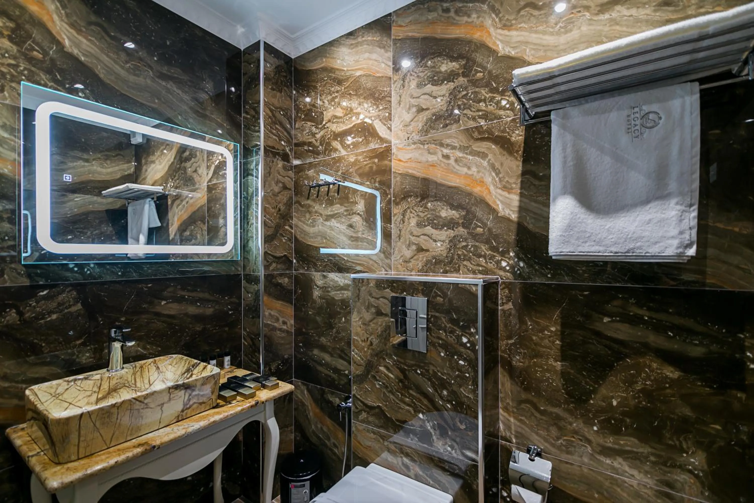 Toilet in Legacy Boutique Hotel