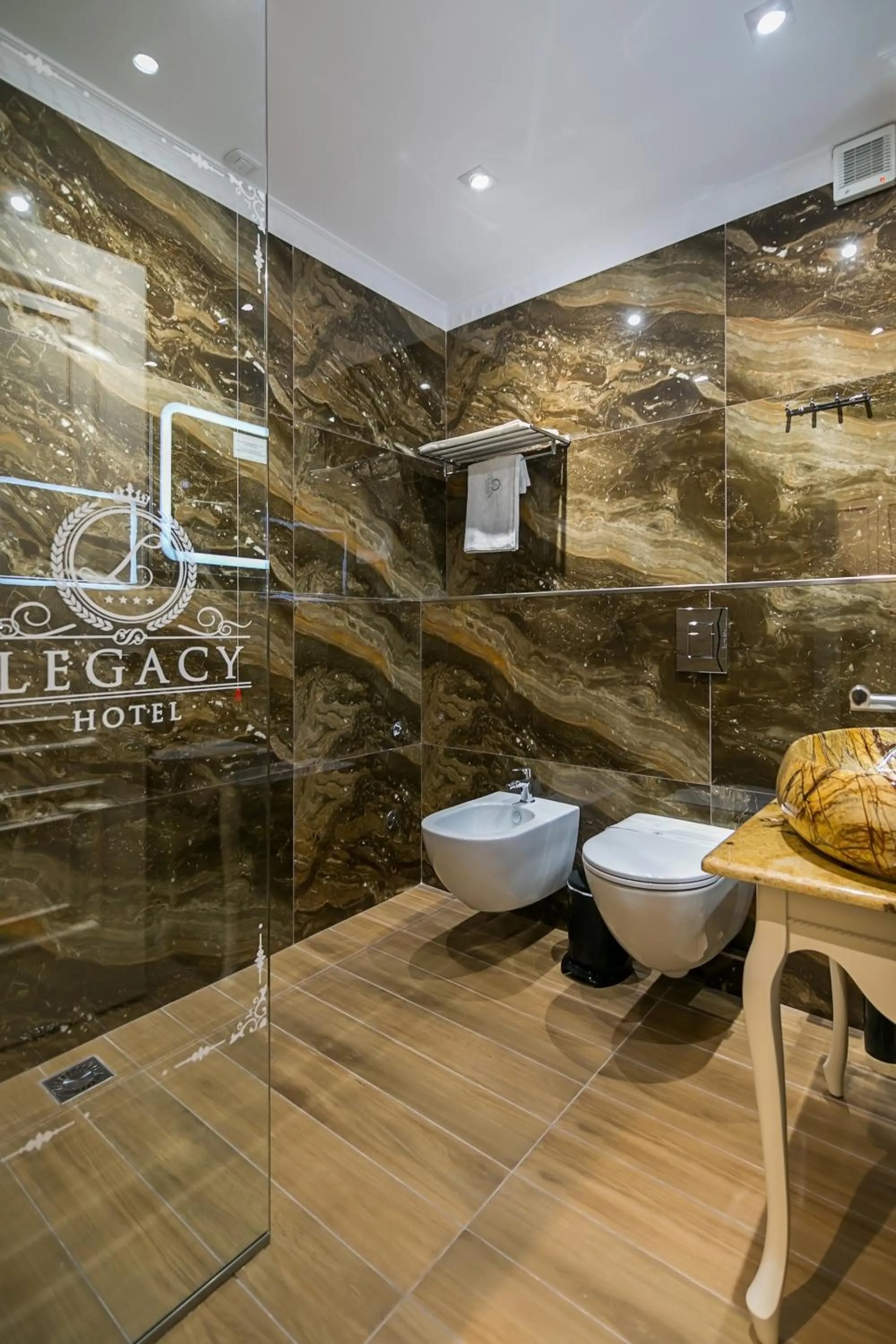 Toilet in Legacy Boutique Hotel