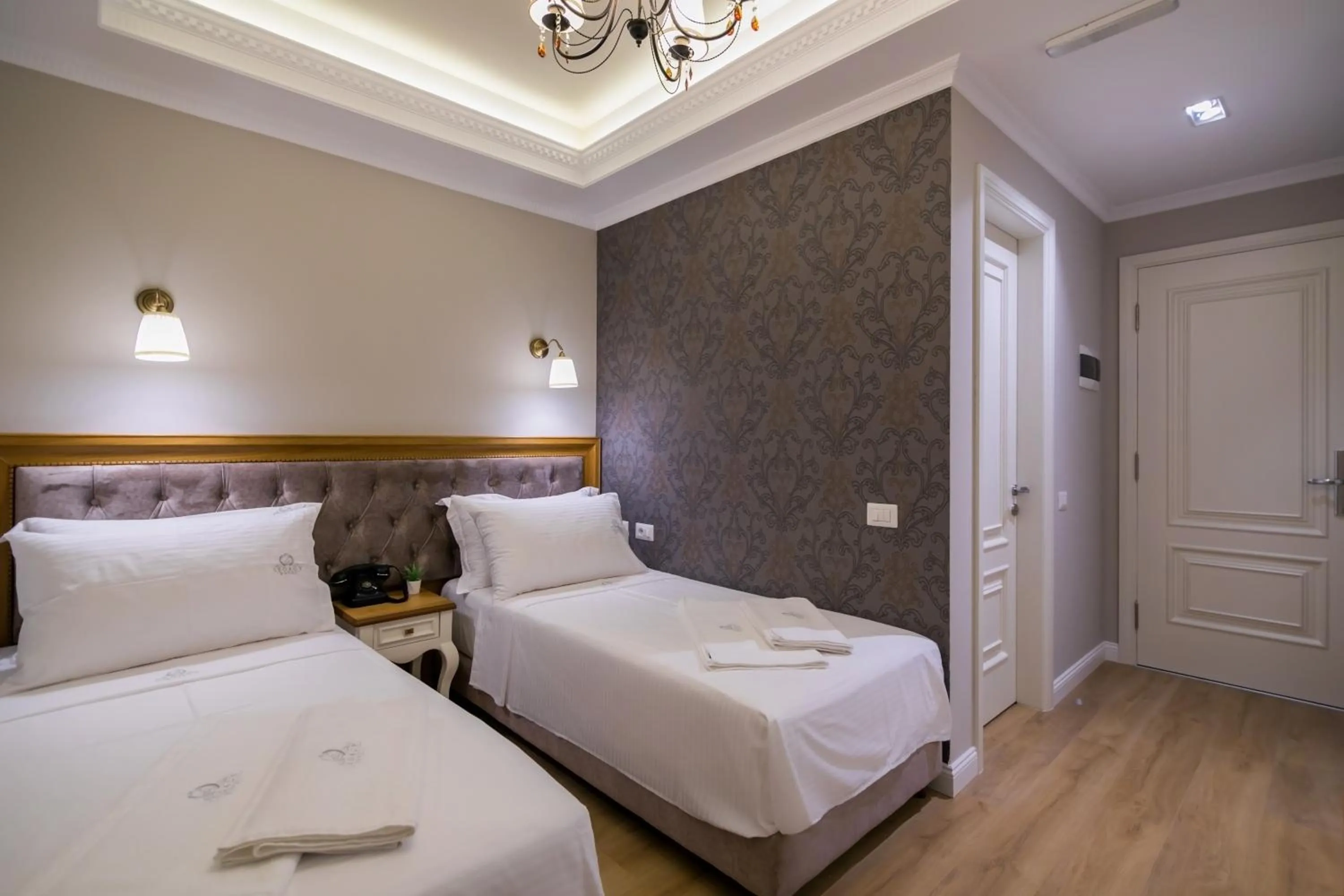 Bed in Legacy Boutique Hotel