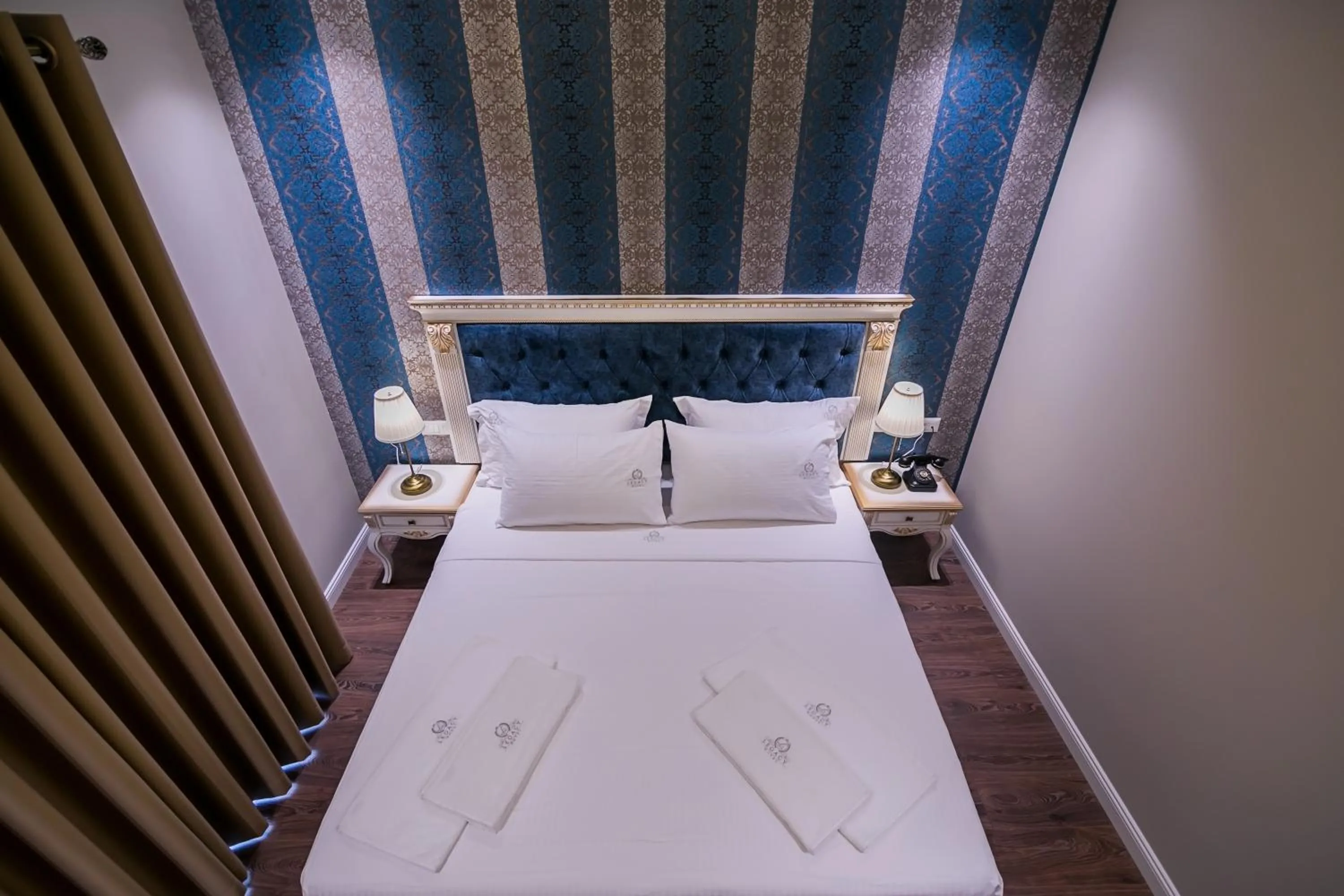 Bed in Legacy Boutique Hotel