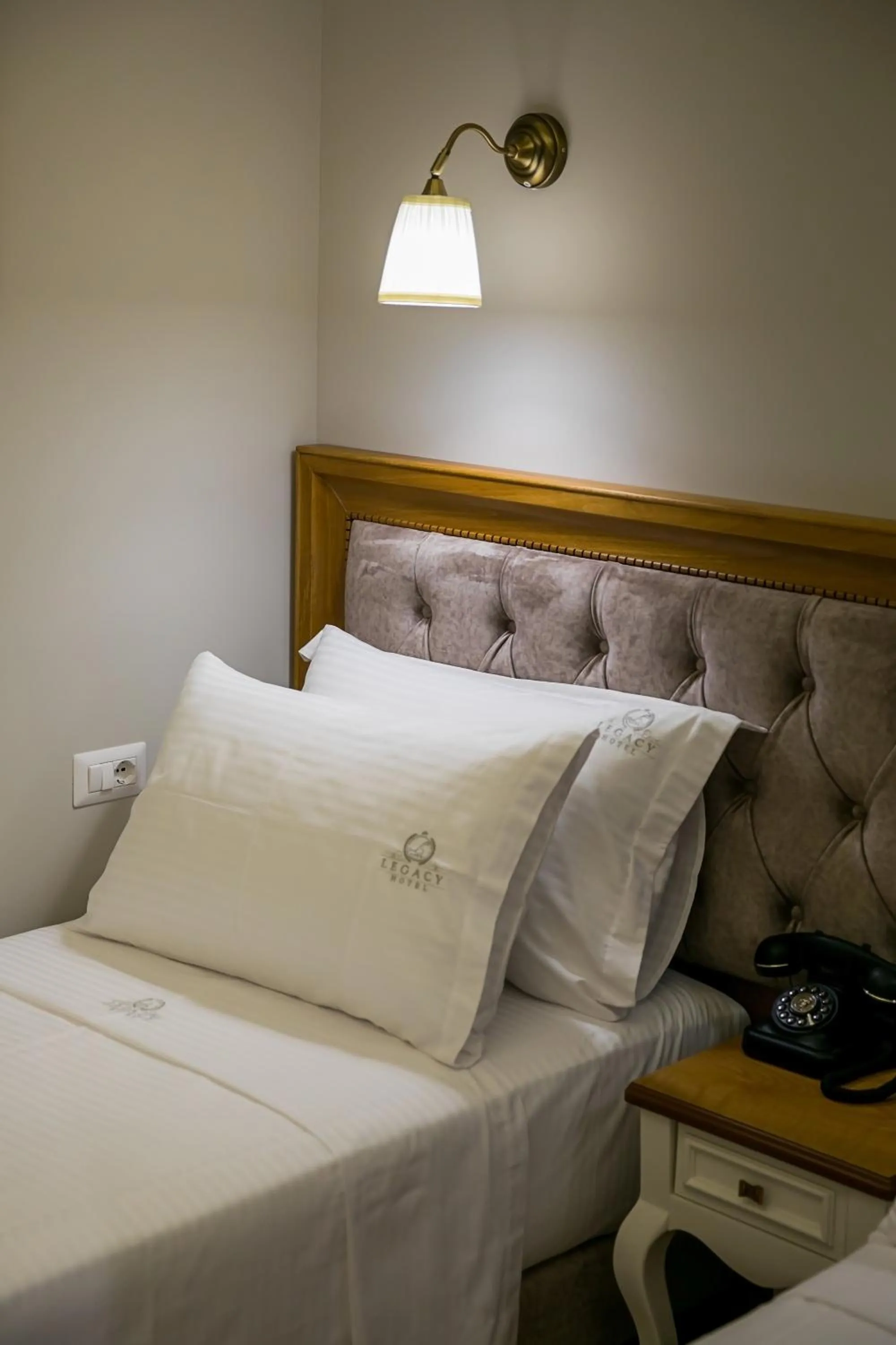 Bed in Legacy Boutique Hotel