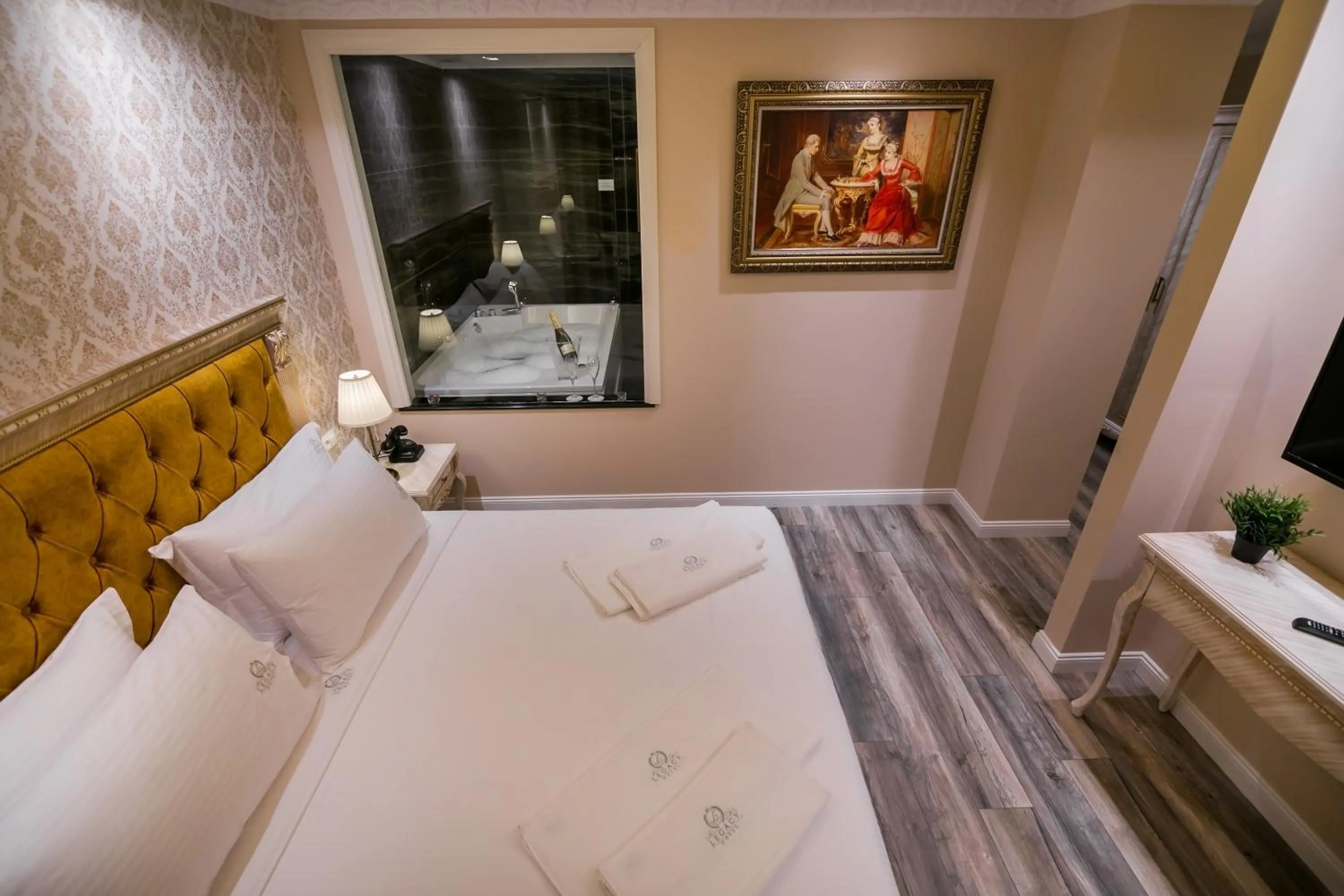 Bed in Legacy Boutique Hotel