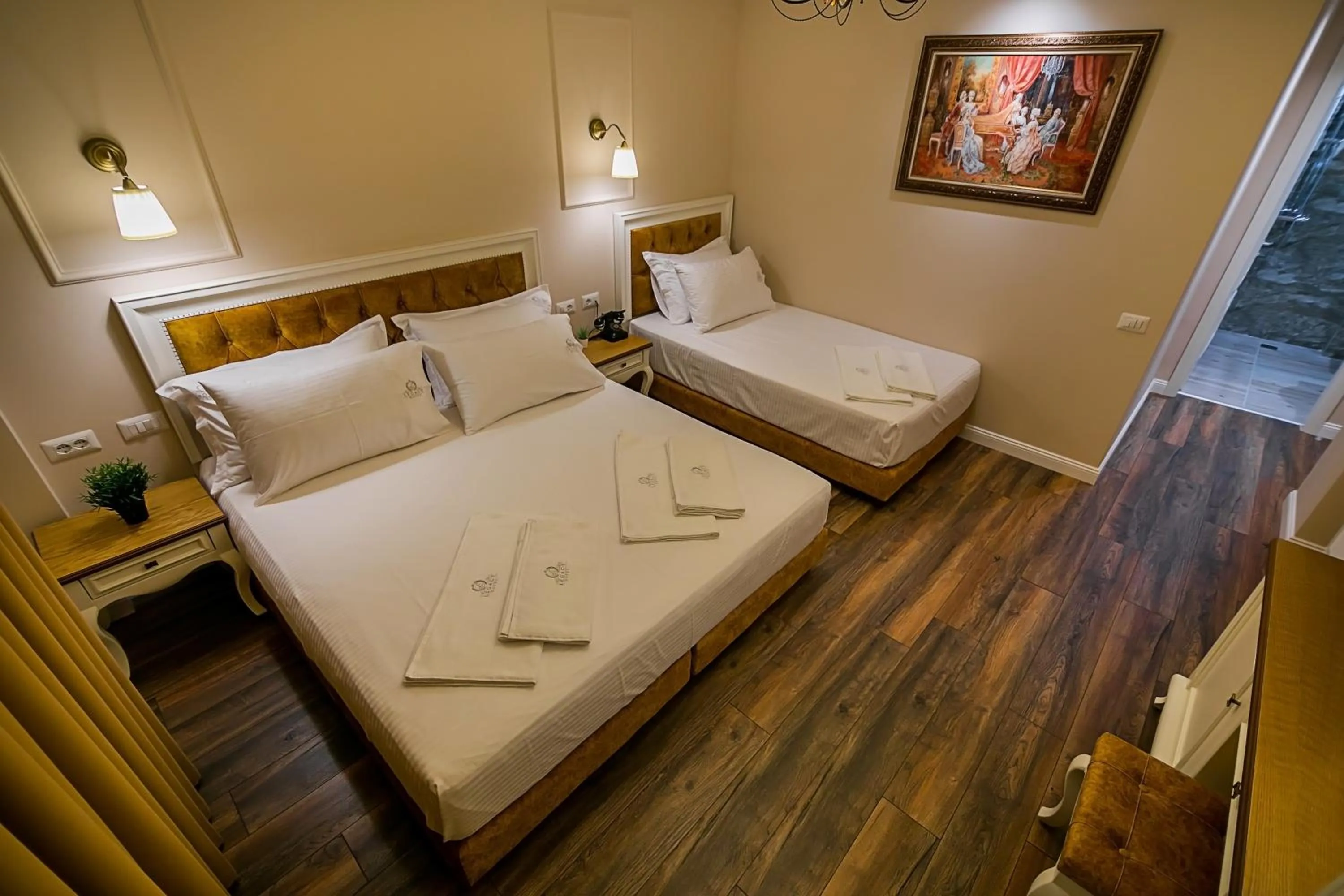 Bed in Legacy Boutique Hotel