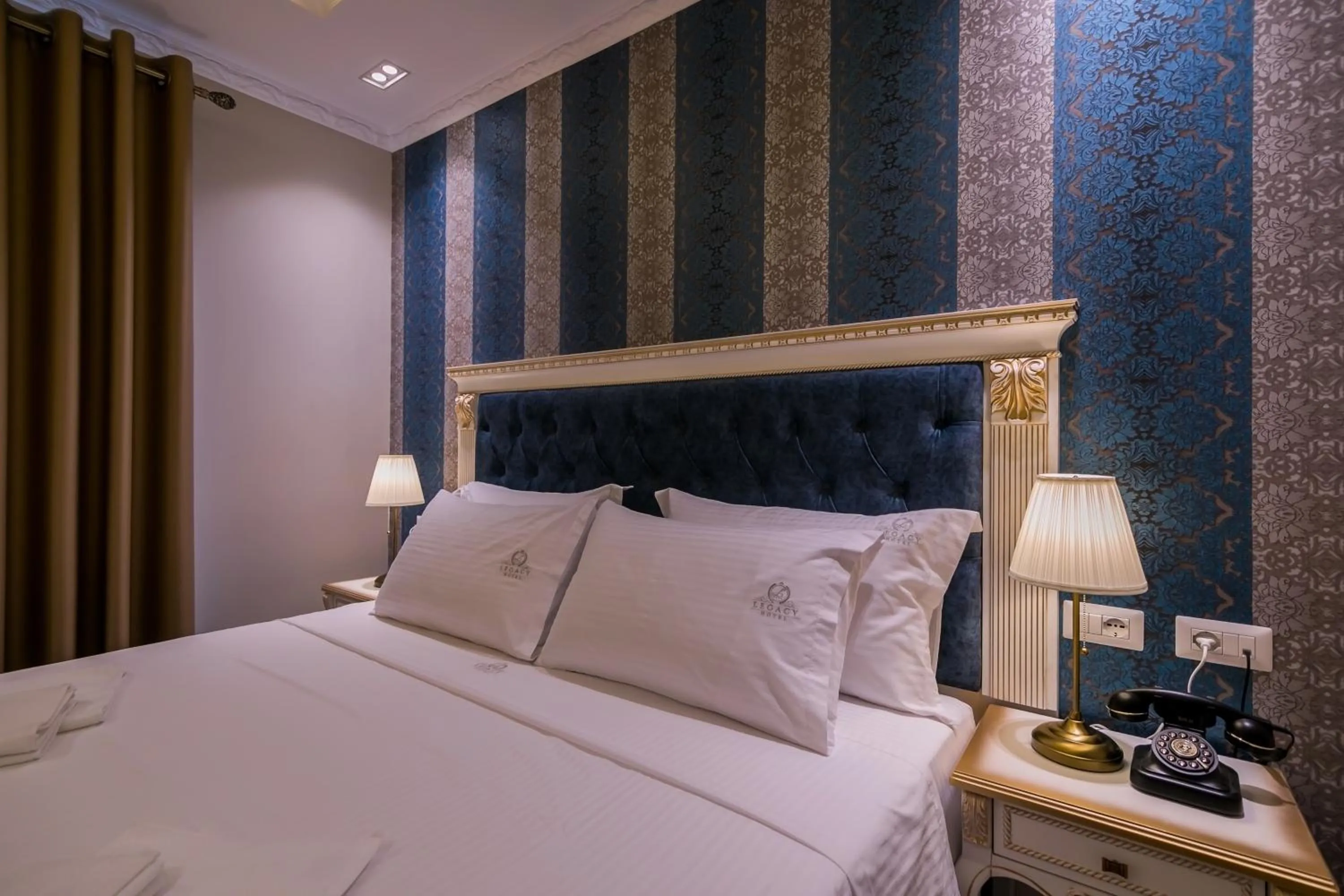 Bed in Legacy Boutique Hotel