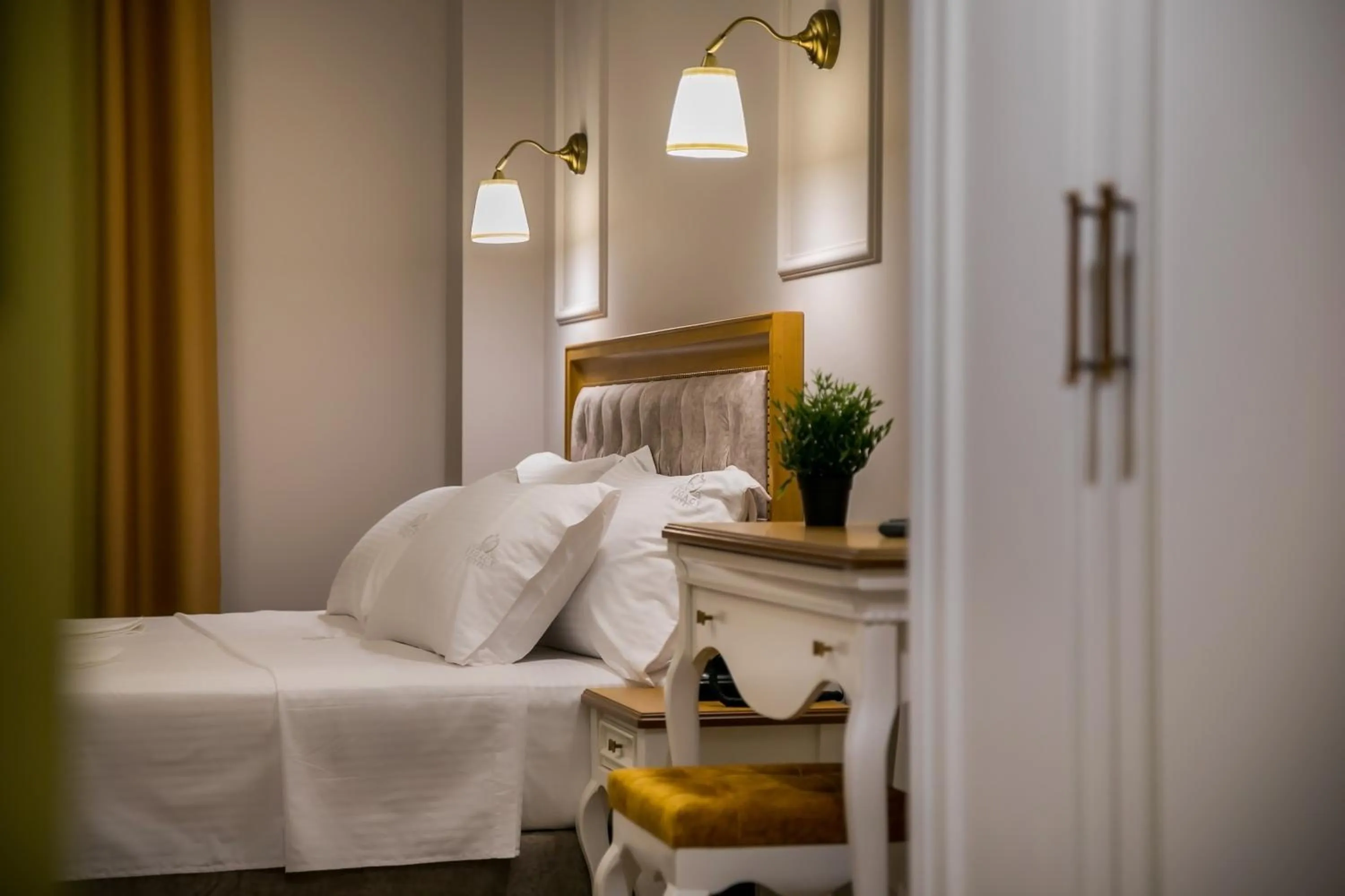 Bed in Legacy Boutique Hotel